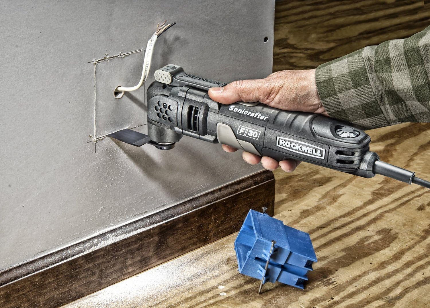 Rockwell Sonicrafter F30 cutting a hole in drywall for an electrical box