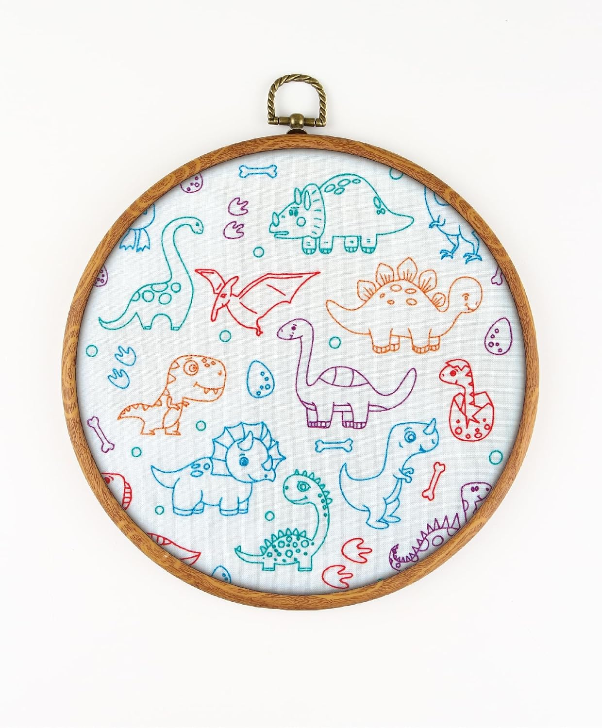 Dino Babies EM210 - DIY Embroidery Kit. Set of Threads, Needles, Stamped Cloth, Needle Threader, Embroidery Clippers and Printed Color Pattern Inside.