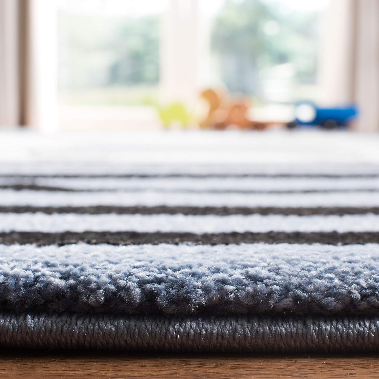 SAFAVIEH Carousel Kids Collection Accent Rug - 2'3" x 4', Navy & Ivory, Stripe Design, Non-Shedding & Easy Care, Ideal for High Traffic Areas for Boys & Girls in Playroom, Nursery, Bedroom (CRK126N)