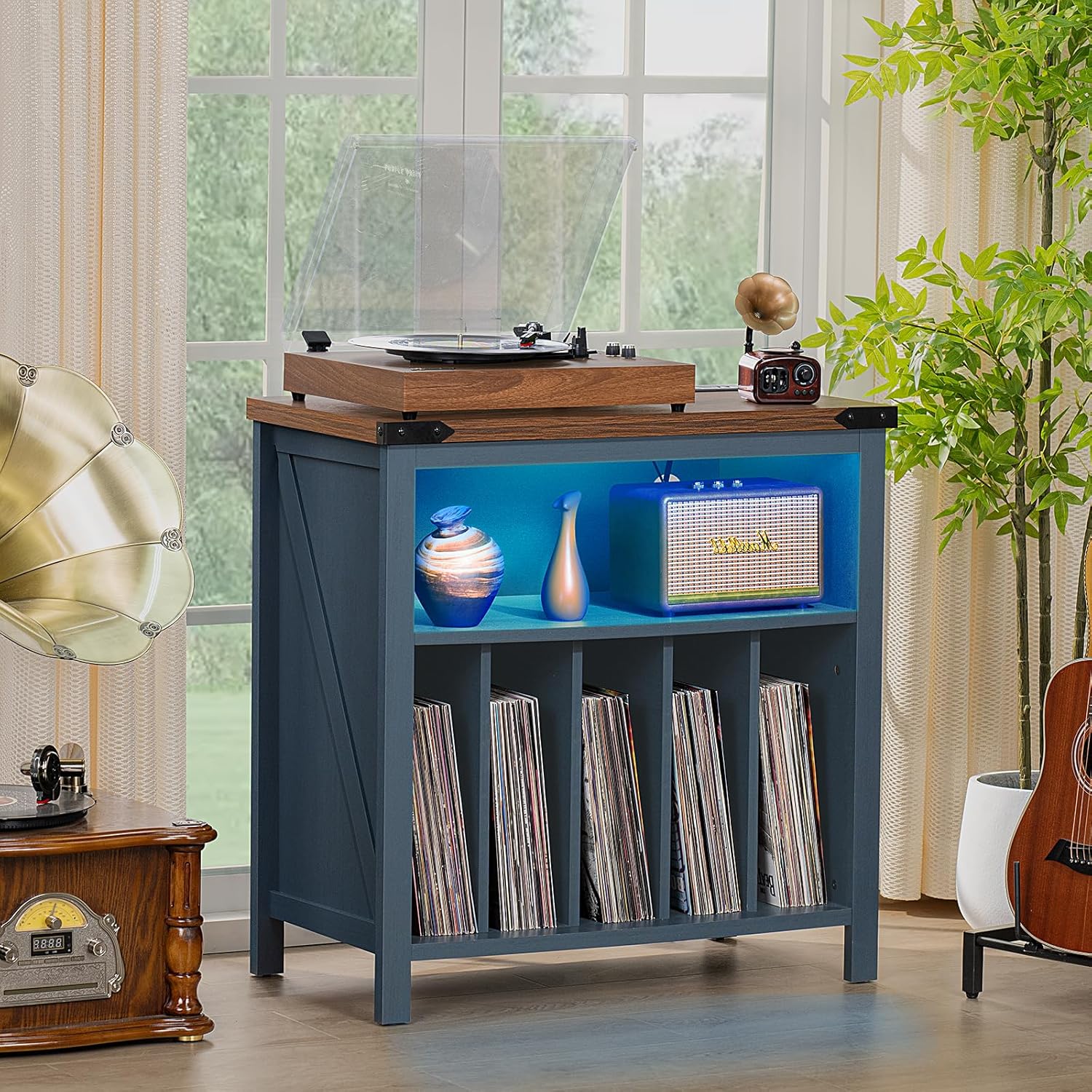 Record player table with blue LED lights illuminating the middle shelf, displaying decorative items and records.