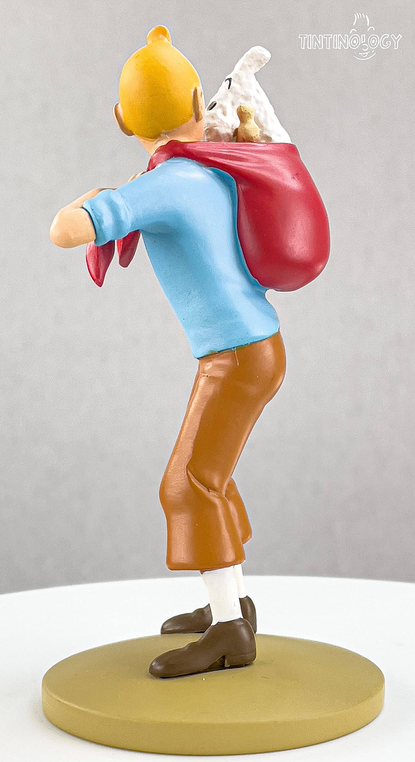 Moulinsart Figurine en résine Tintin Portant à Milu (42194)
