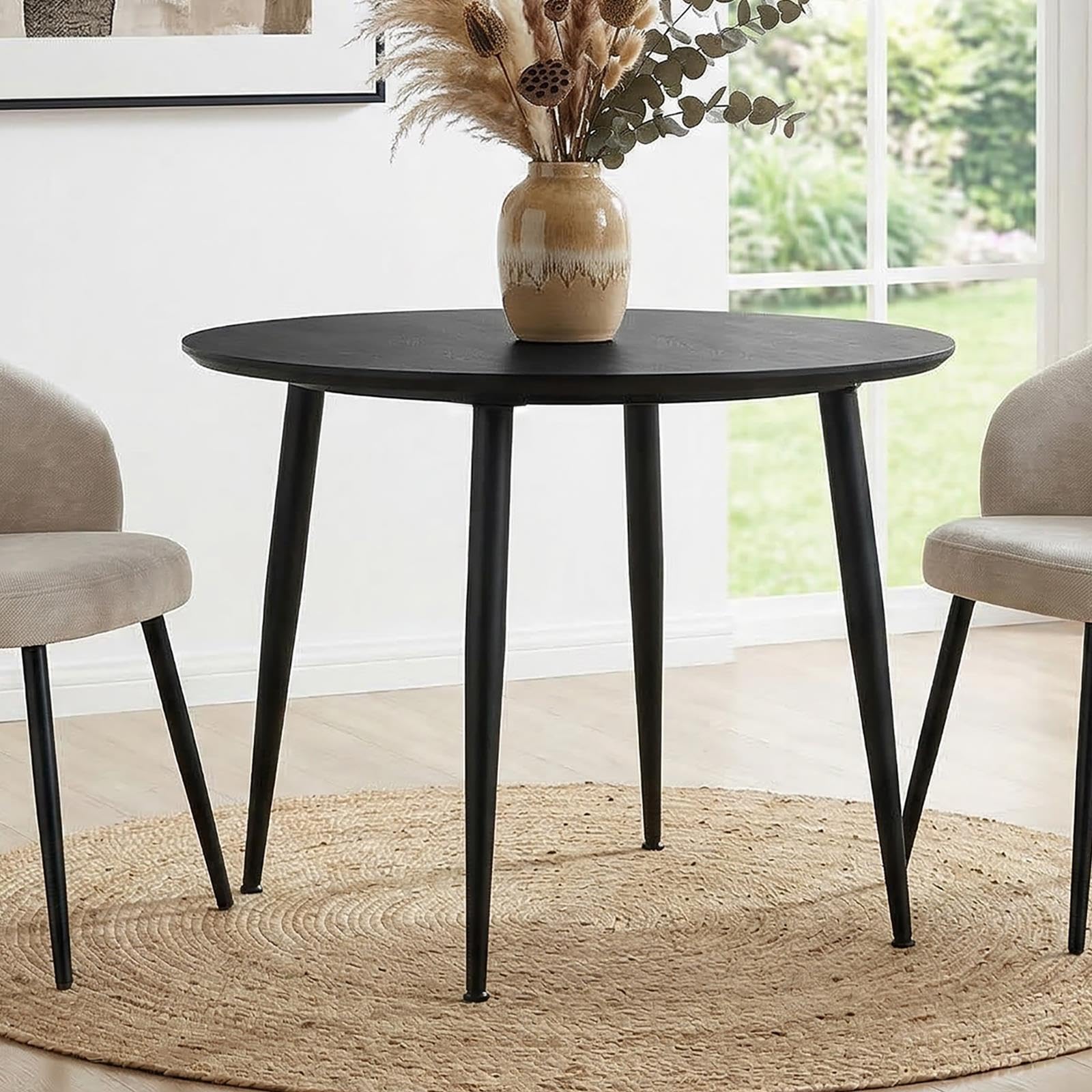 Table ronde noire 100 cm IDIMEX pour partager de chaleureux repas en famille
