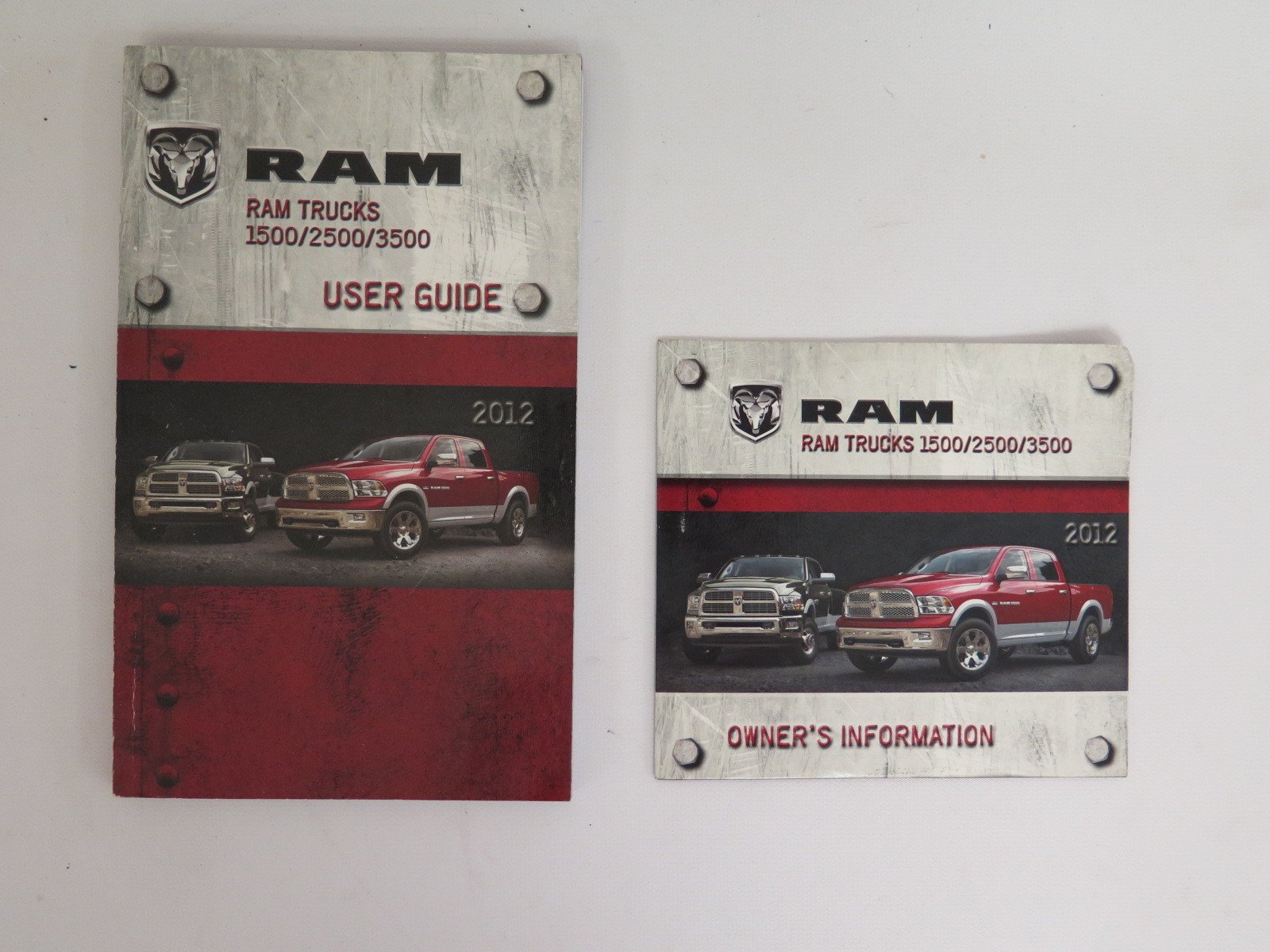 Cover of the 2012 Dodge Ram Truck Owner's Manual showing a red and a green Ram truck.