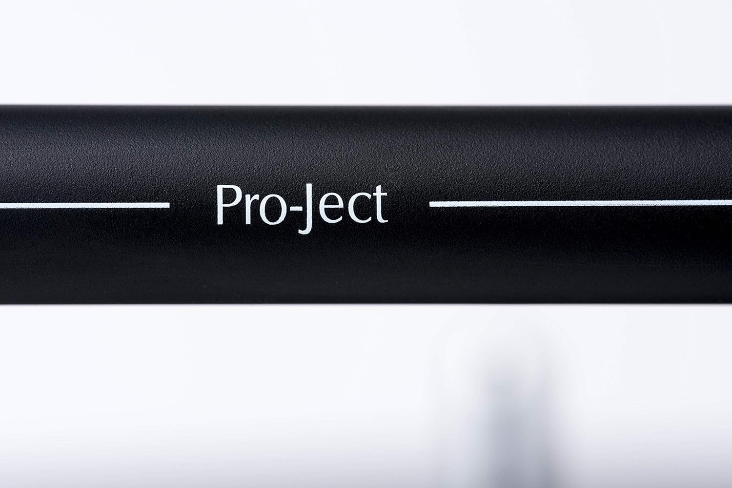 Close-up of the Pro-Ject tonearm with 'Pro-Ject' branding