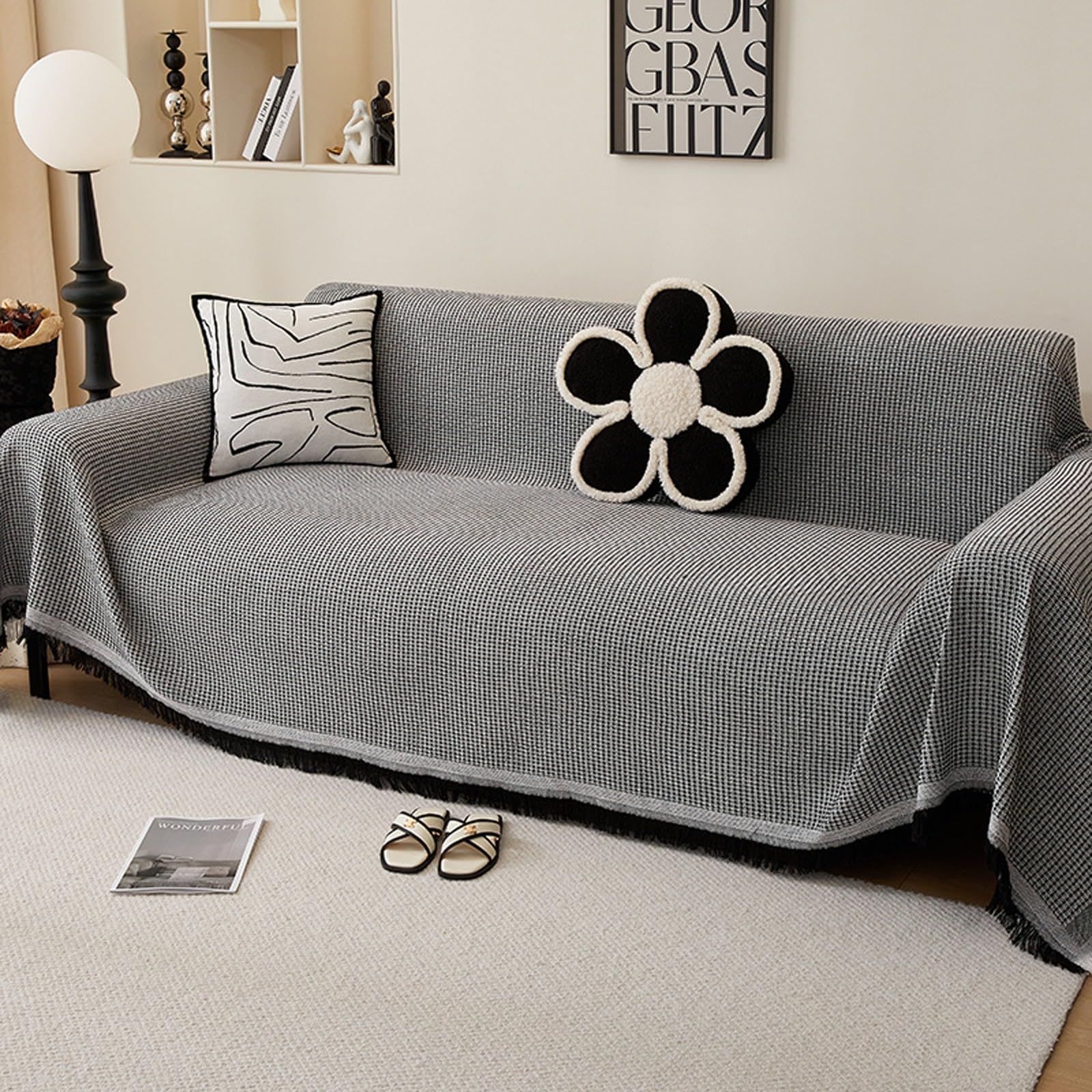 Housse de canapé lavable noire avec pompons protection anti-glisse