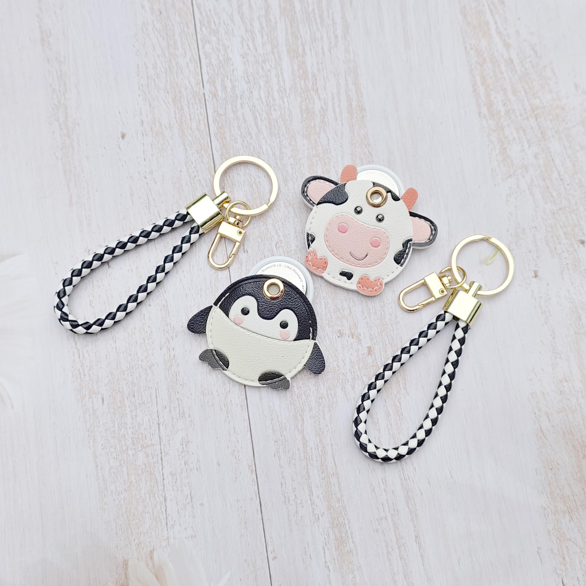 CATCH ON 2 Pack Leather Airtag Keychain Case Holder, Cute Kawaii Accessories Suitable for Airtag (Cow - Penguin)