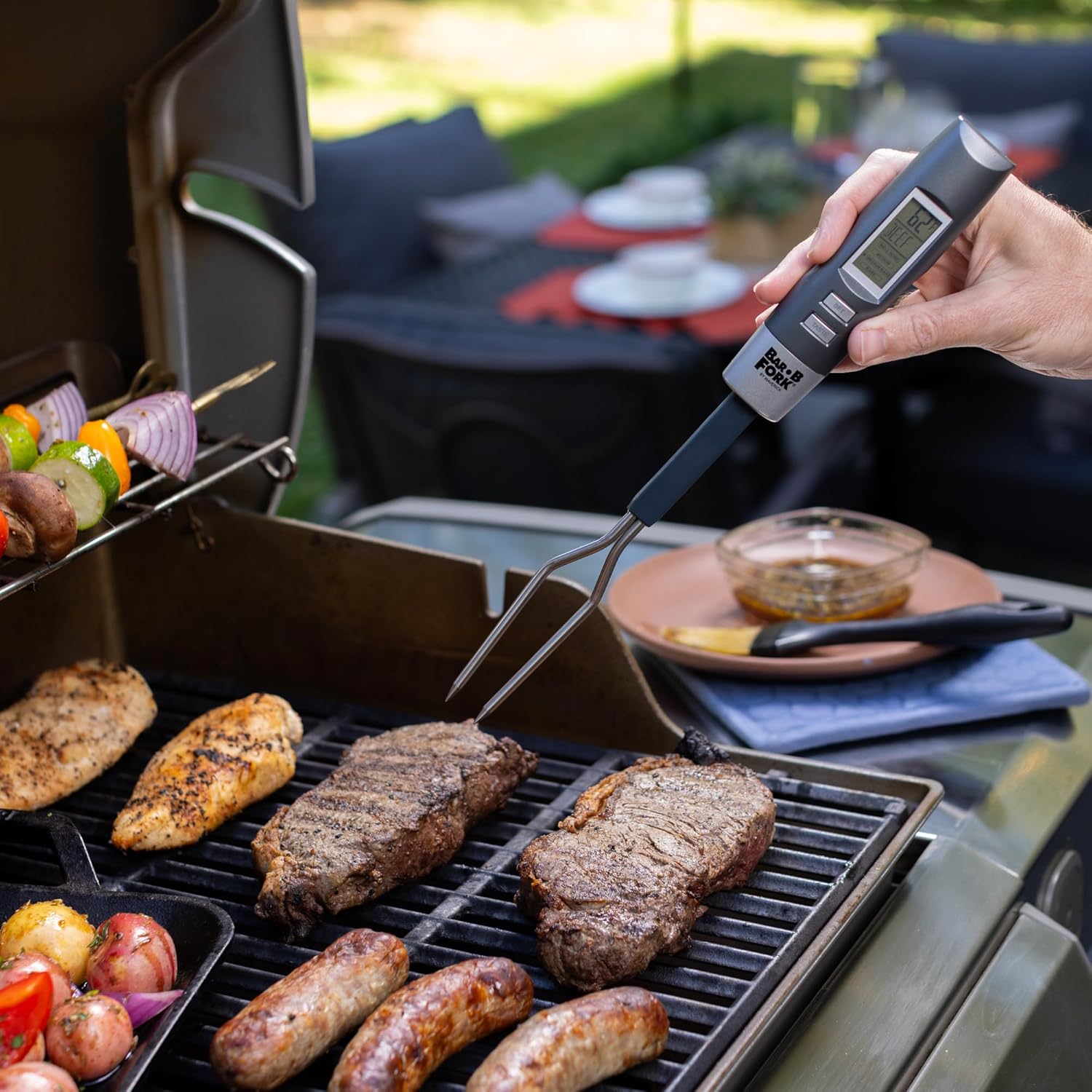Maverick BarBFork displaying temperature on a grill