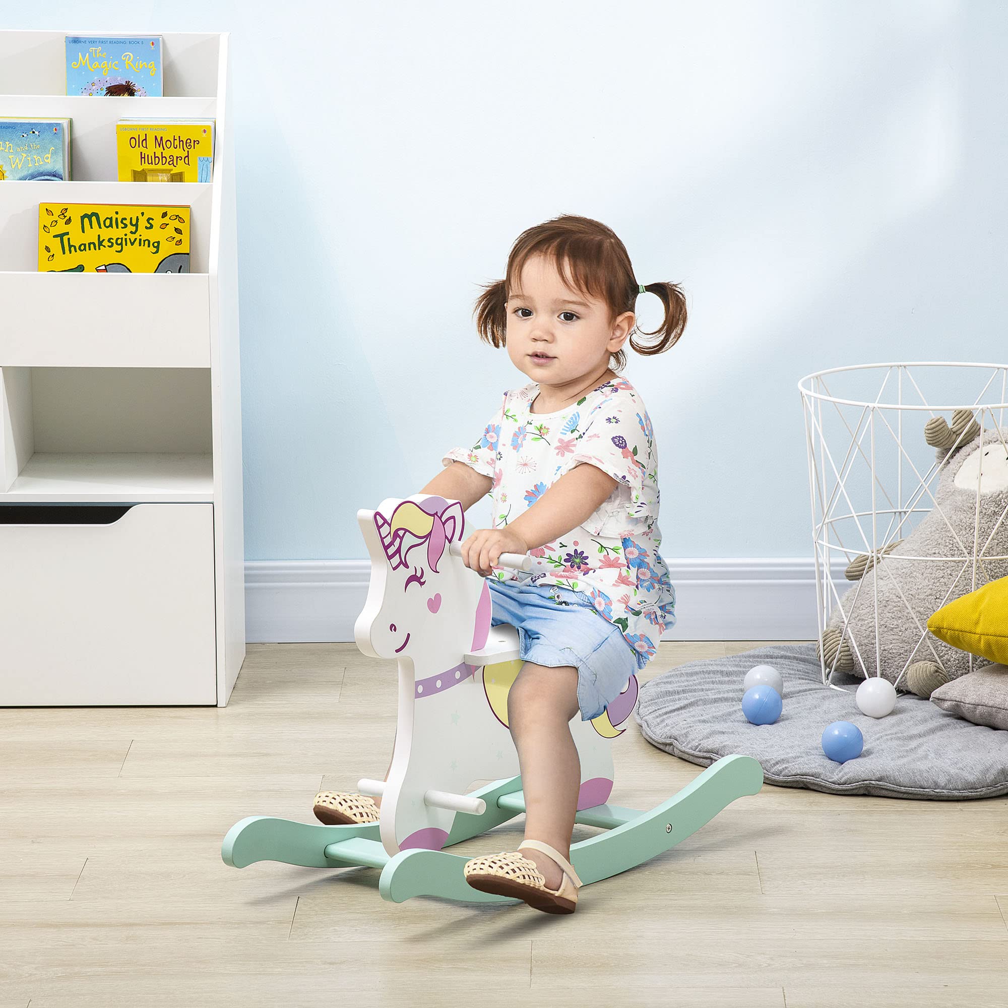 HOMCOM Caballo balancín para niños de 1 a 3 años, caballito balancín con asas, respaldo y pedales de MDF, 68 x 27 x 47,5 cm, azul, rosa y blanco