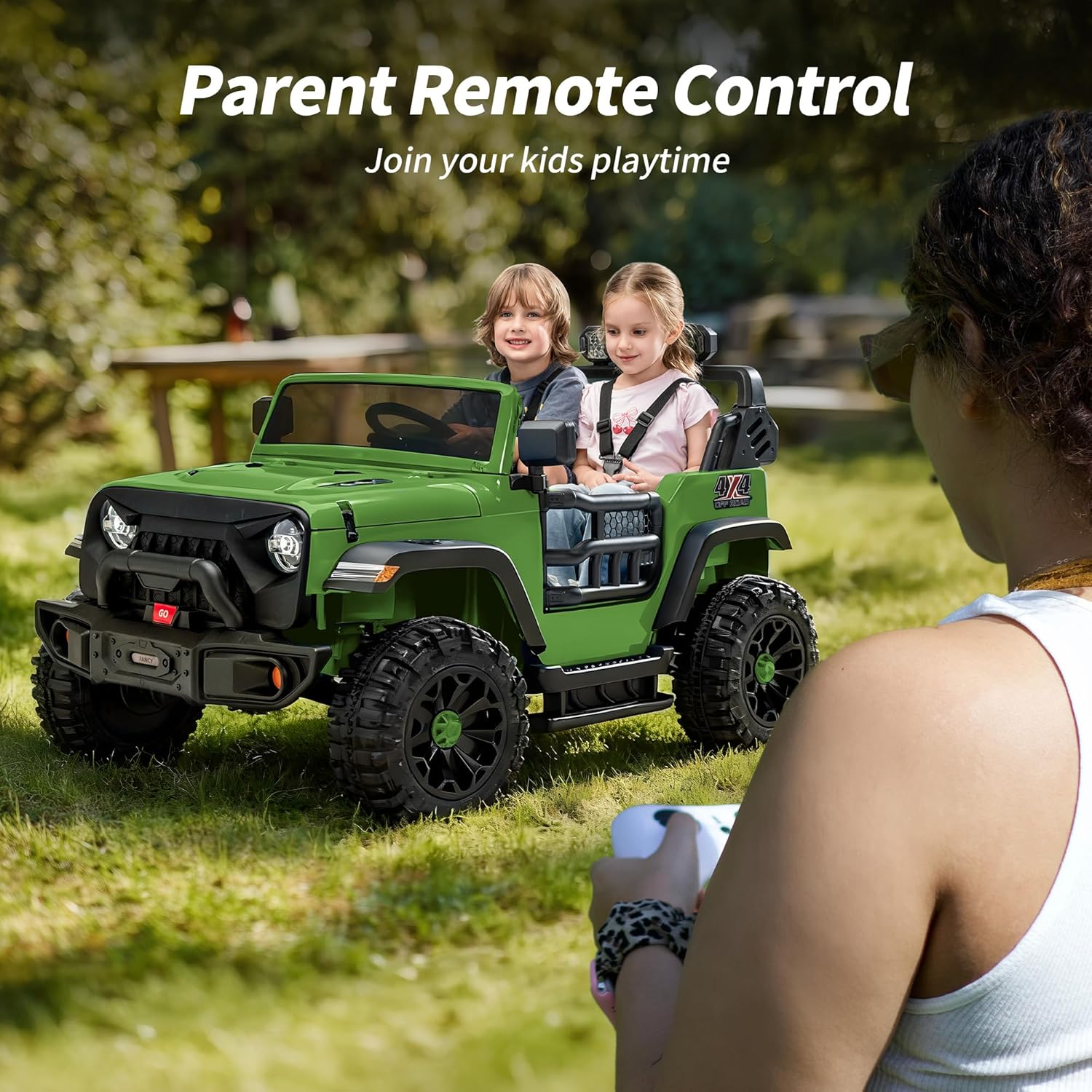 Parent using remote control to guide the ride-on car with two children inside.