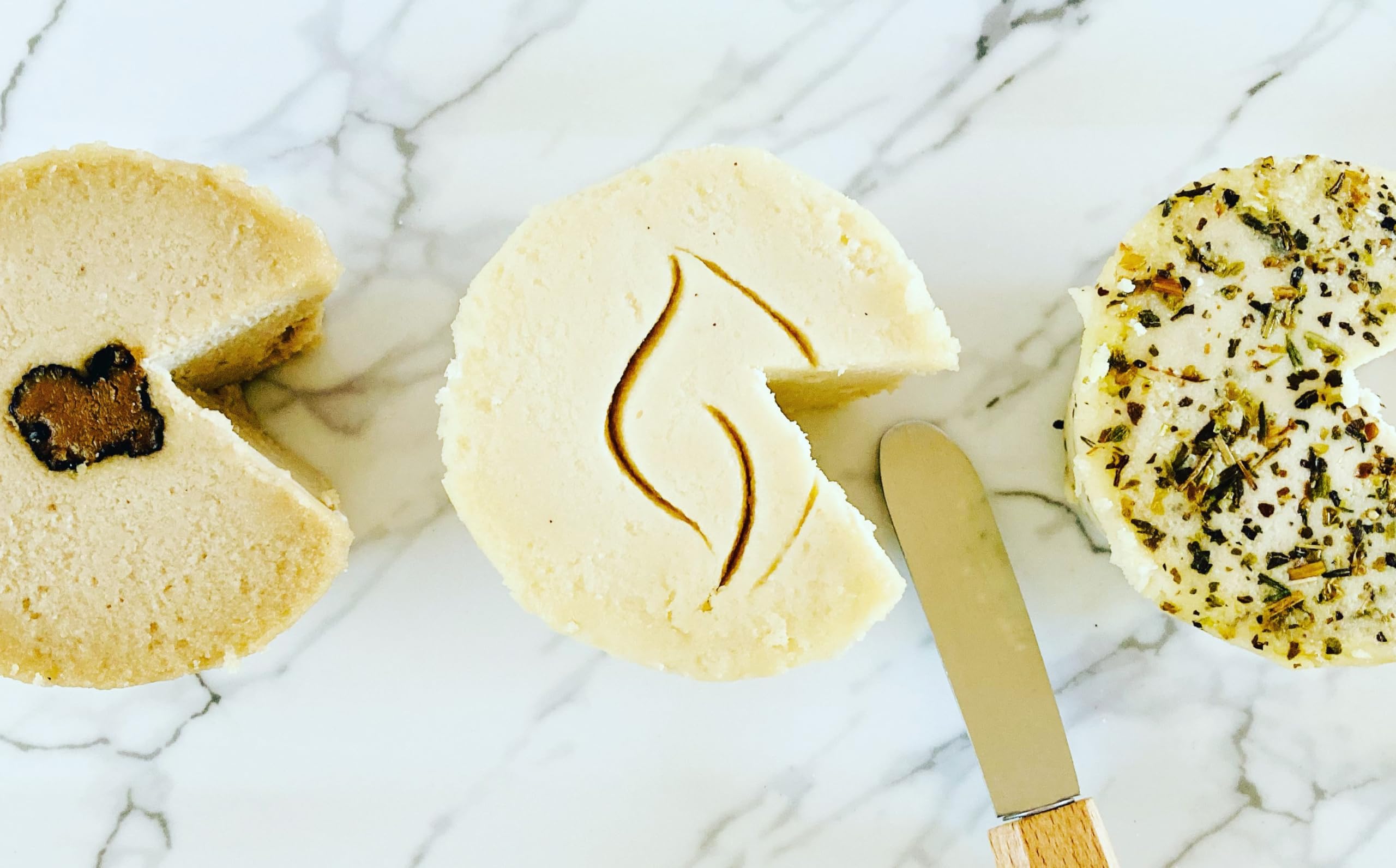 THE VEGAN CHEESE SHOPPE Macadamia Nut ''Brie'' Trio: Classic, Herbes de Provence & Black Truffle. Smooth & Creamy Vegan Rindless Brie alternative.