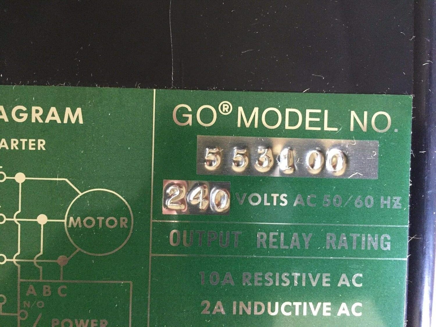 Close-up of the model number and voltage rating on the GOTRONIC 553100 Power Line Monitor.