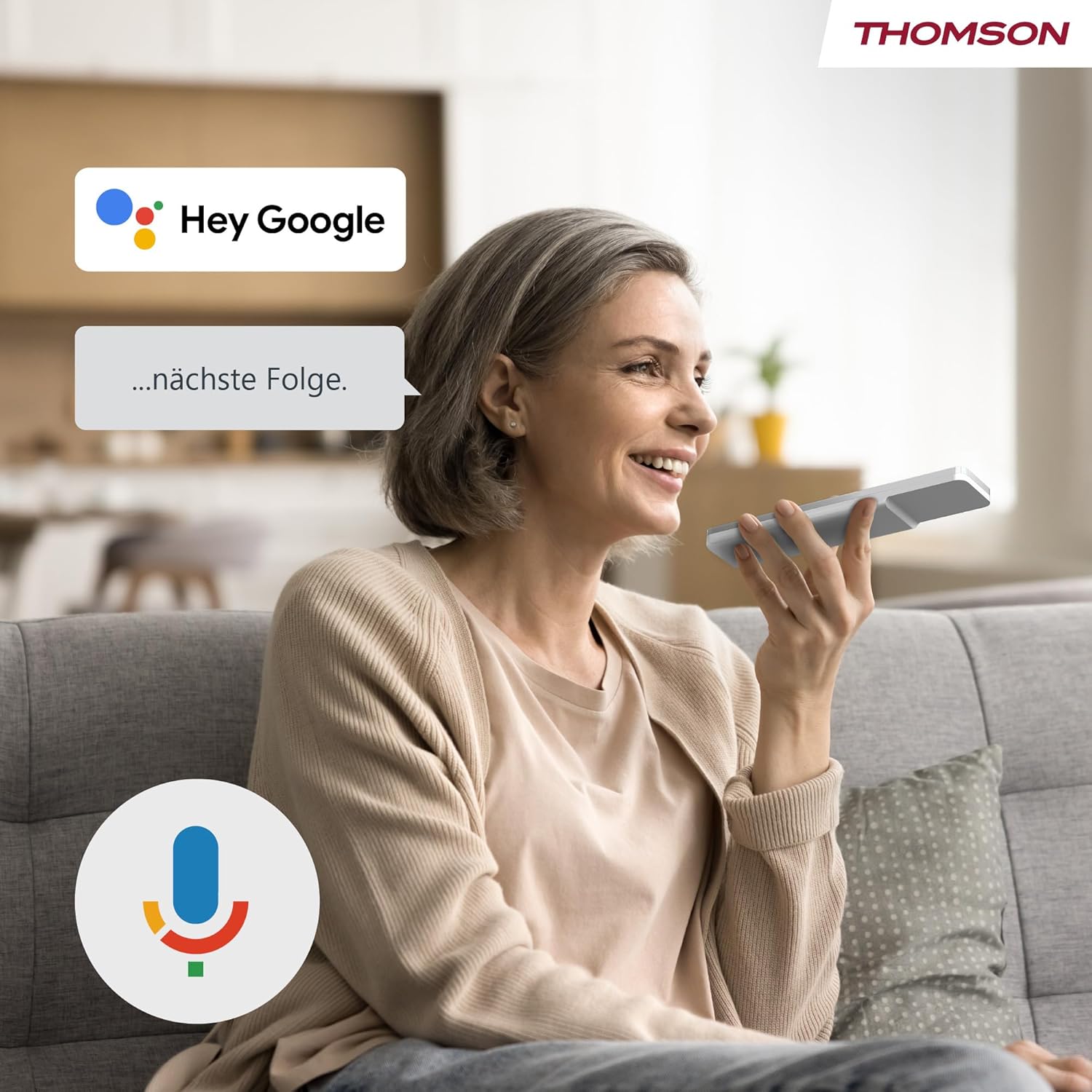 Woman using voice control with THOMSON Go TV remote