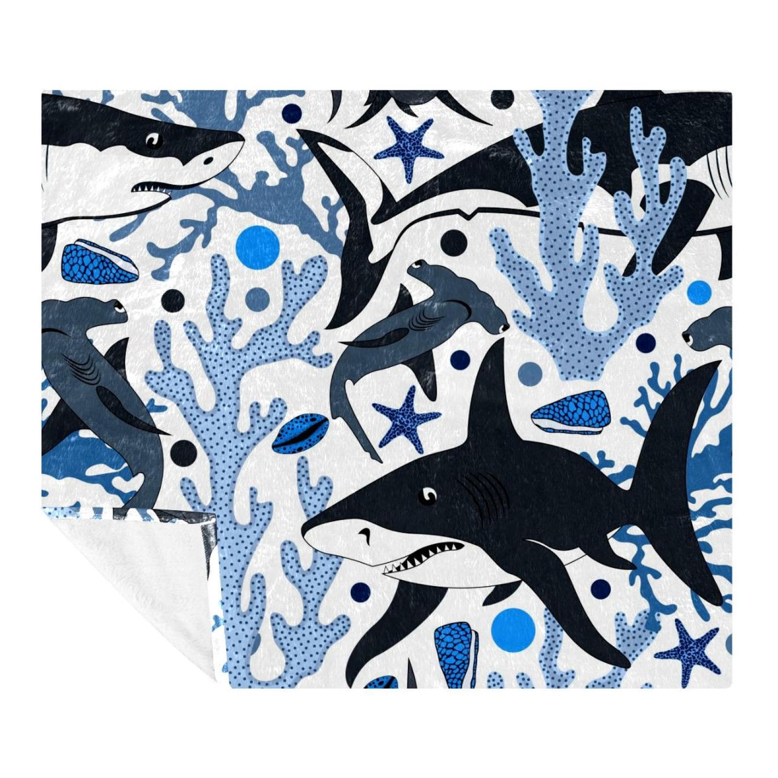 Couverture polaire requins et coquillages pour vos soirées canapé