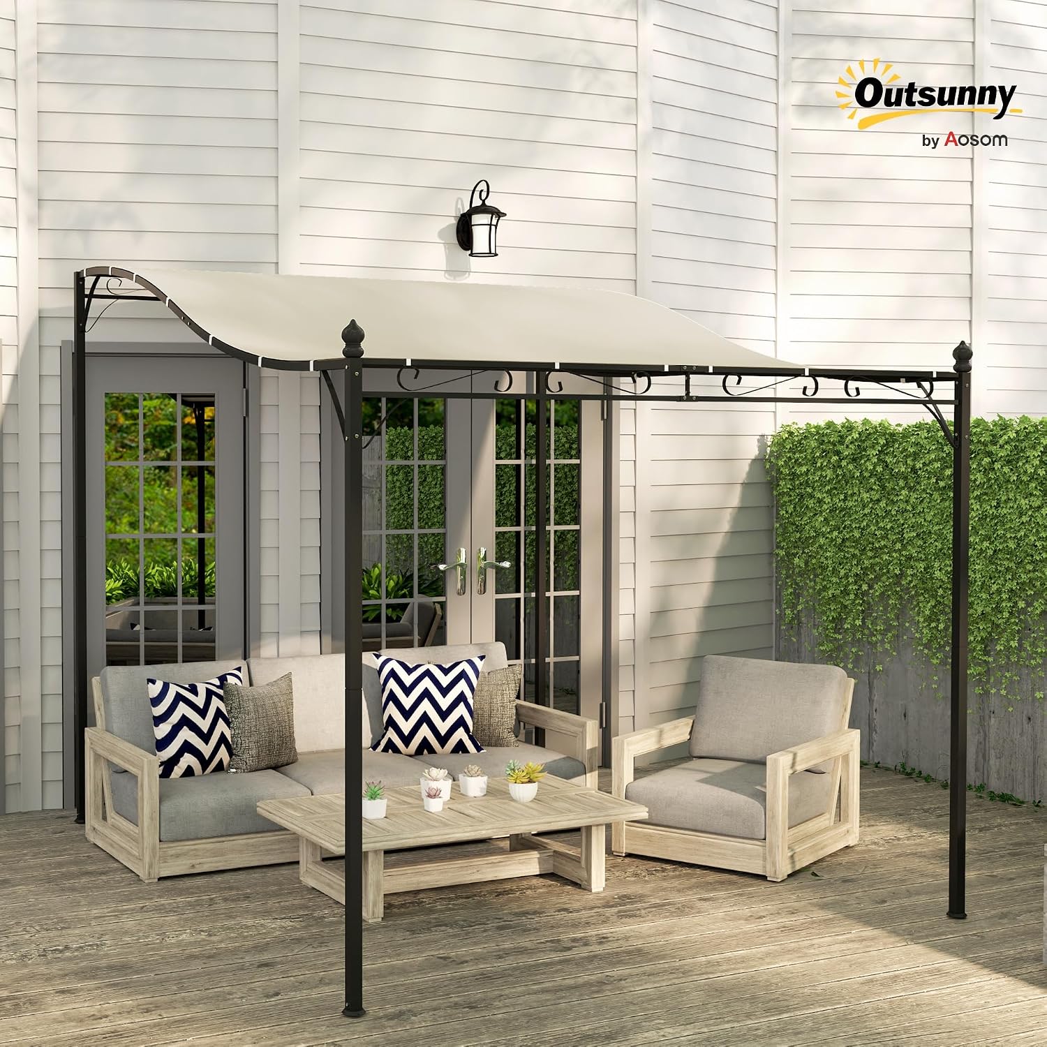 Outsunny 3x2.5m Garden Pergola installed on a wooden deck next to a house, providing shade over outdoor furniture.