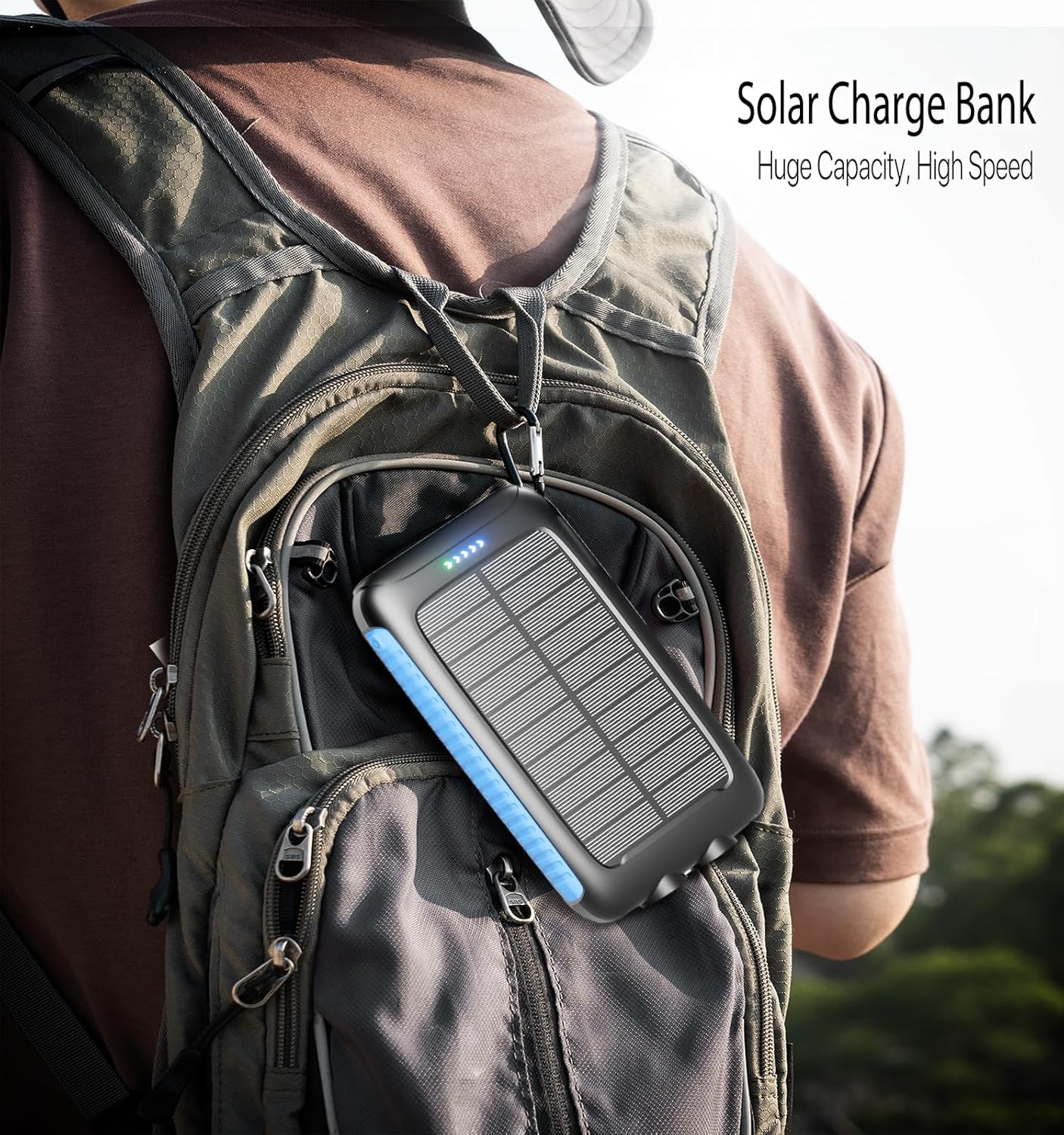 Nuynix power bank attached to a backpack, with its solar panel exposed to sunlight for charging.