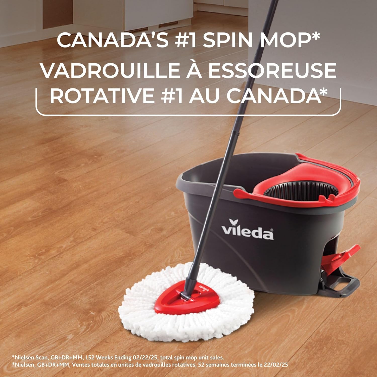 The Vileda EasyWring mop and bucket system positioned on a clean wooden floor.
