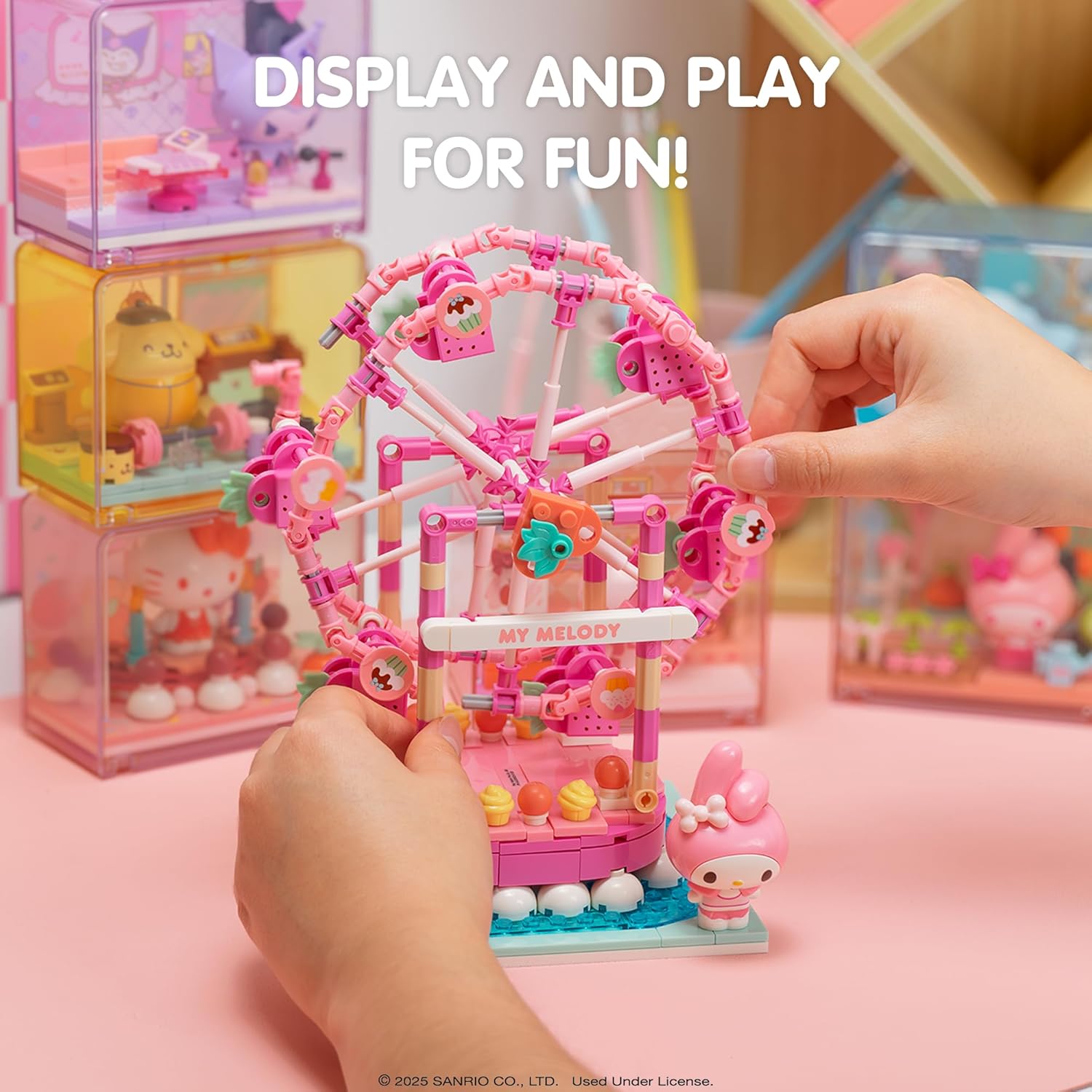 Hands interacting with the My Melody Ferris Wheel, demonstrating its movable parts