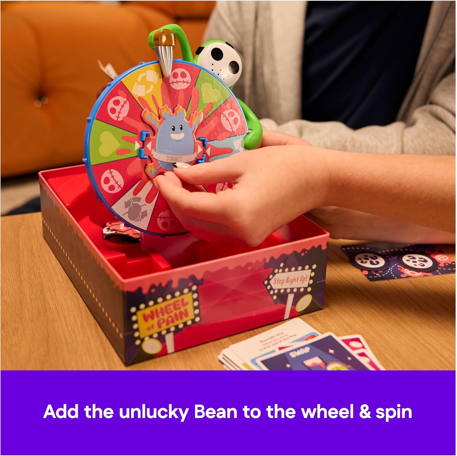 Spin Master Games, Dumb Ways to Die: Wheel of Pain Game, Interactive Spinning Wheel, Viral Meme Survival Strategy Fun for Kids, Adults & Family Game Night, 2-6 Players, for Ages 12 & Up