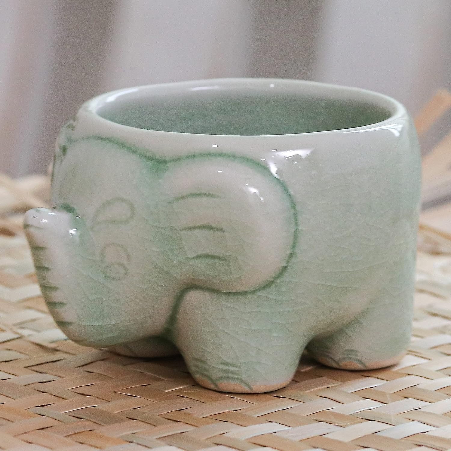NOVICA Handmade Celadon Ceramic Teacup in Green Thailand Tableware Dinnerware Mugs Cups Animal Themed Elephant [1.9in H x 3.3in W x 2.6in D 2 Oz.] 'Lanna Elephant'