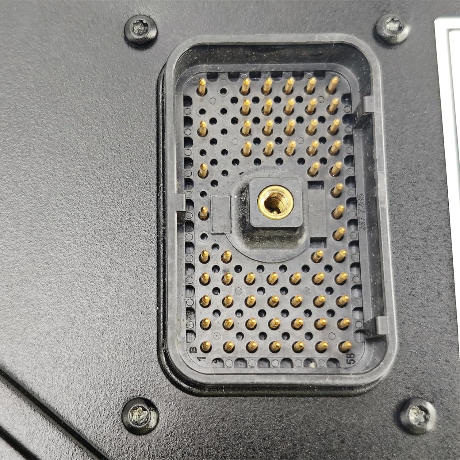 Close-up view of the multi-pin electrical connector on the HIRINTOL Electronic Control Module (ECM).
