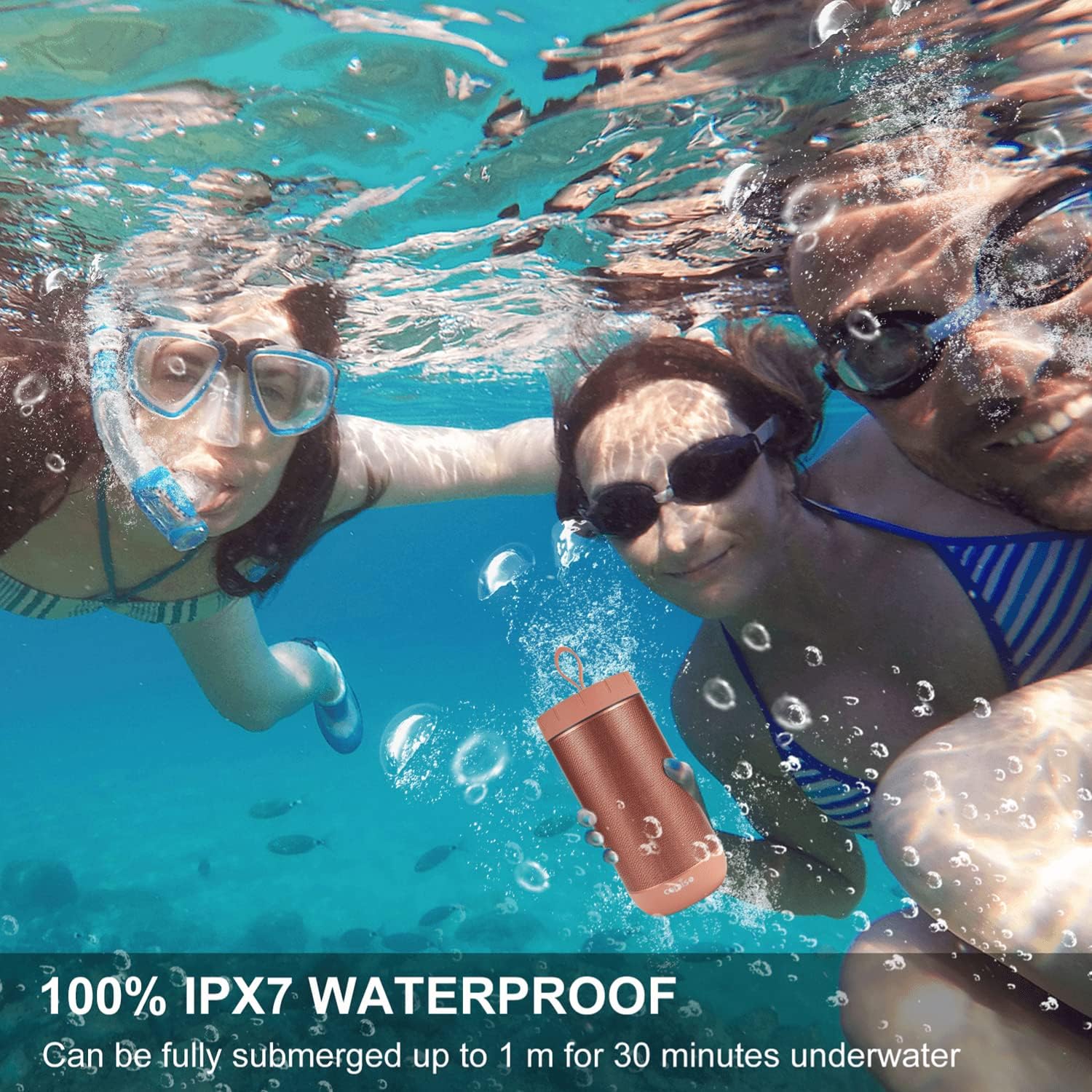 Three people swimming underwater with a COMISO X26L speaker, highlighting its IPX7 waterproof feature.