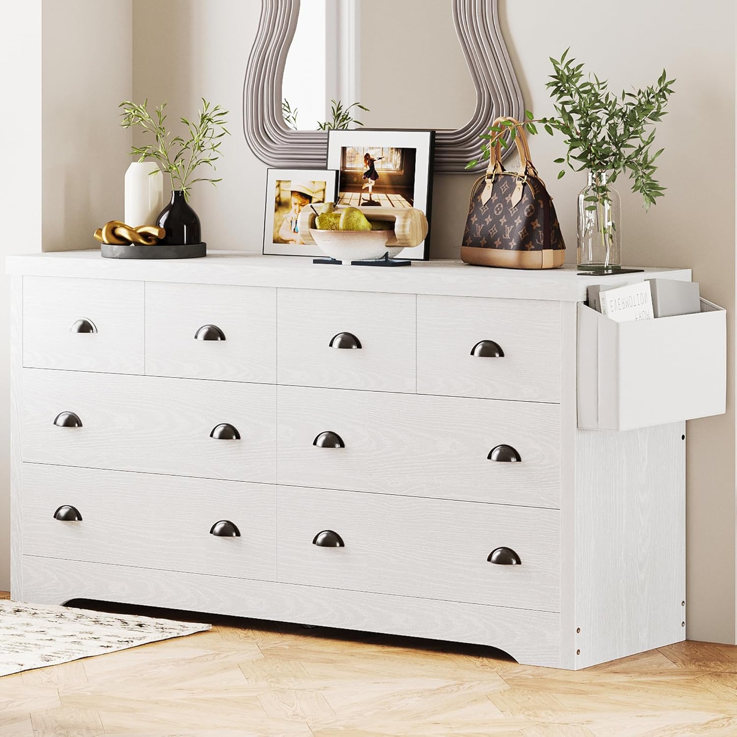 The LIKIMIO 8-drawer dresser in a bedroom setting, showcasing its white finish and cup handles.
