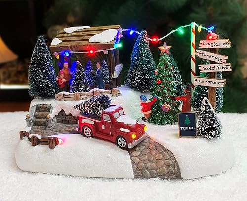 Moments In Time Edificio de pueblo navideño, lote de árbol con luces LED y música navideña, funciona con pilas (no incluidas) (adaptador opcional de