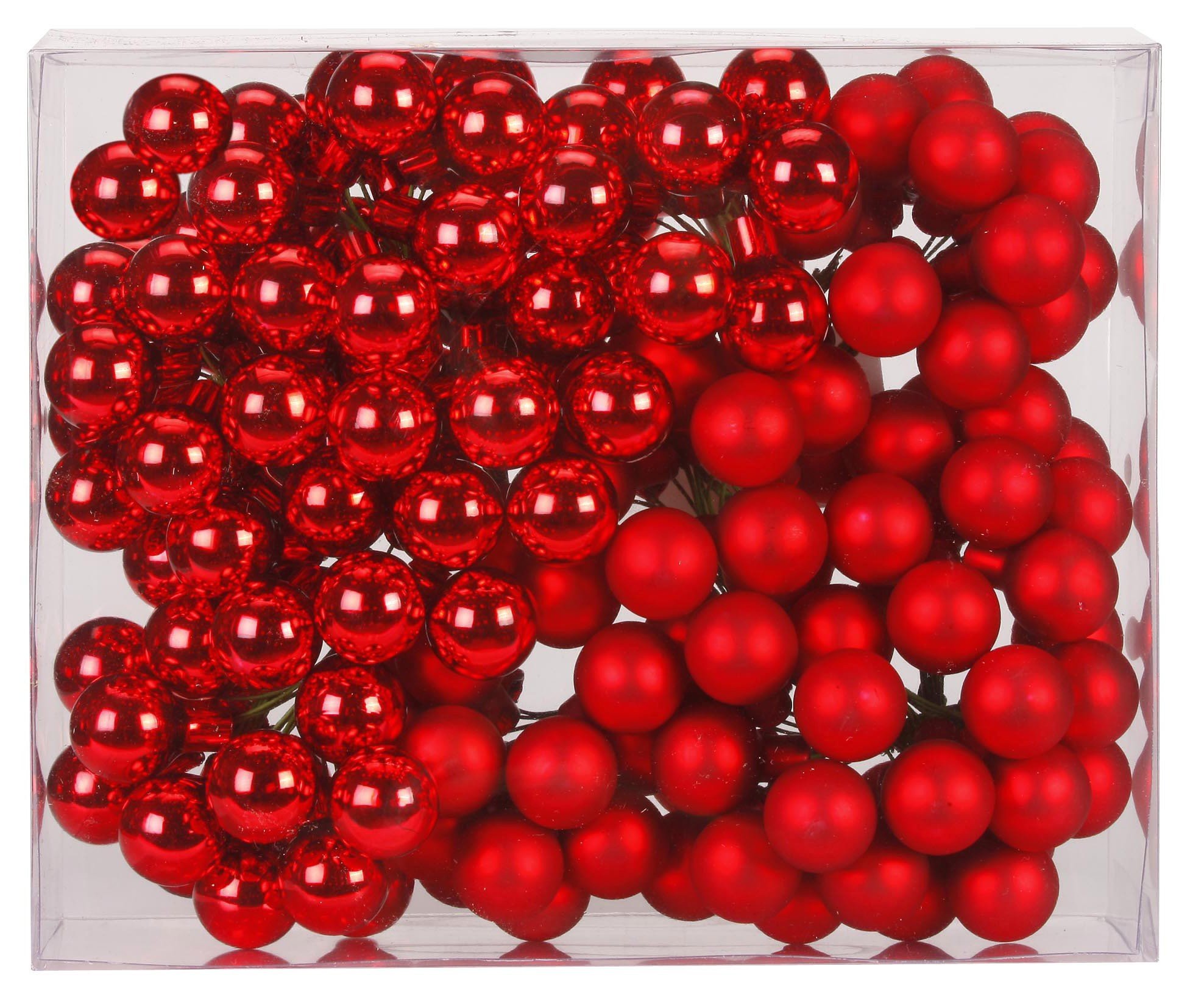 Boules de Noël en grappe rouge mat et brillant pour décorer une table de fête chaleureuse