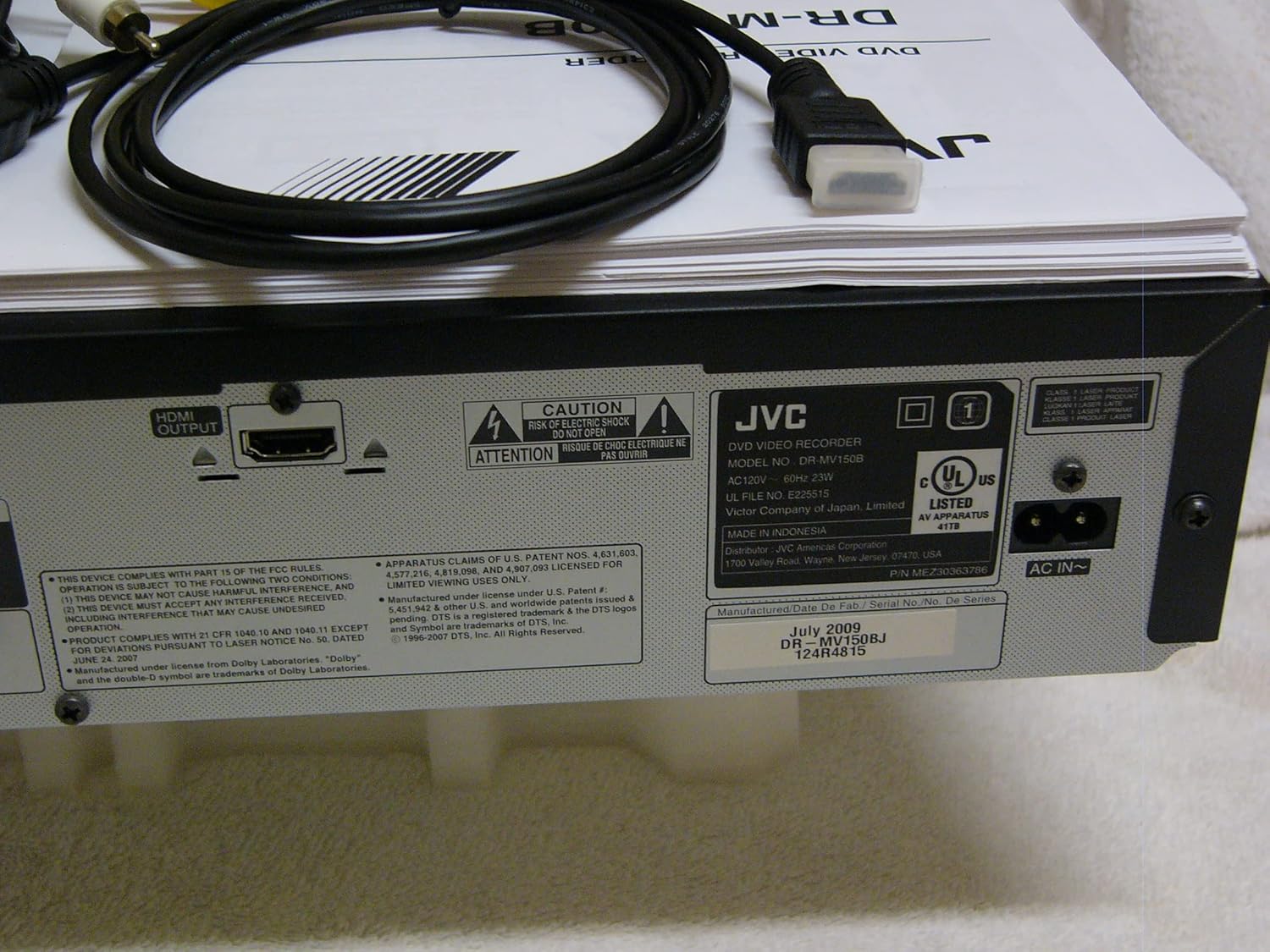 Rear panel of the JVC DR-MV150 showing HDMI output, AC IN, and regulatory labels.
