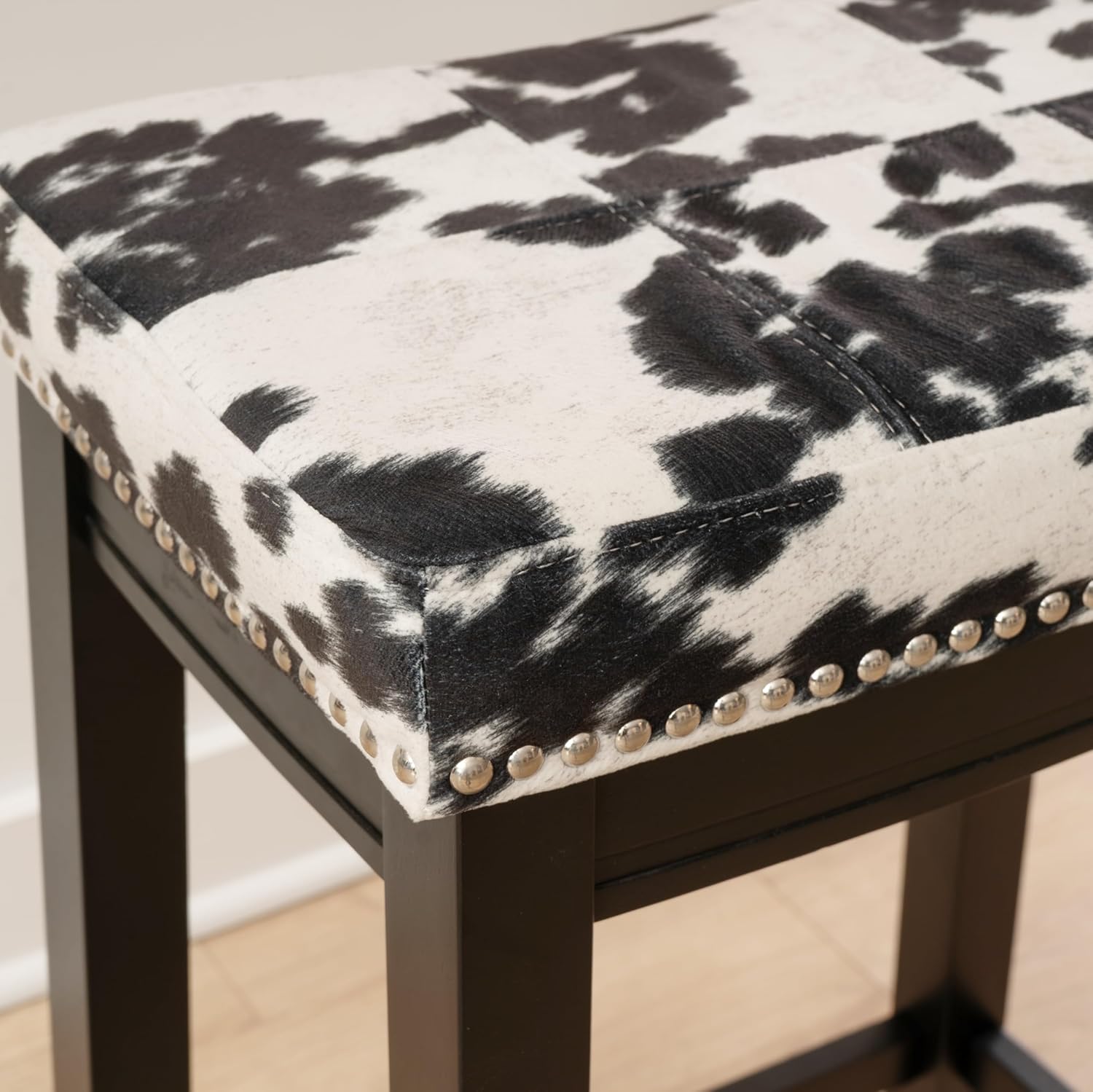 Linon Claridge Black Wooden 24 Incch Seat Height Counter Stool with Black and White Faux Cow Print Upholstered Seat