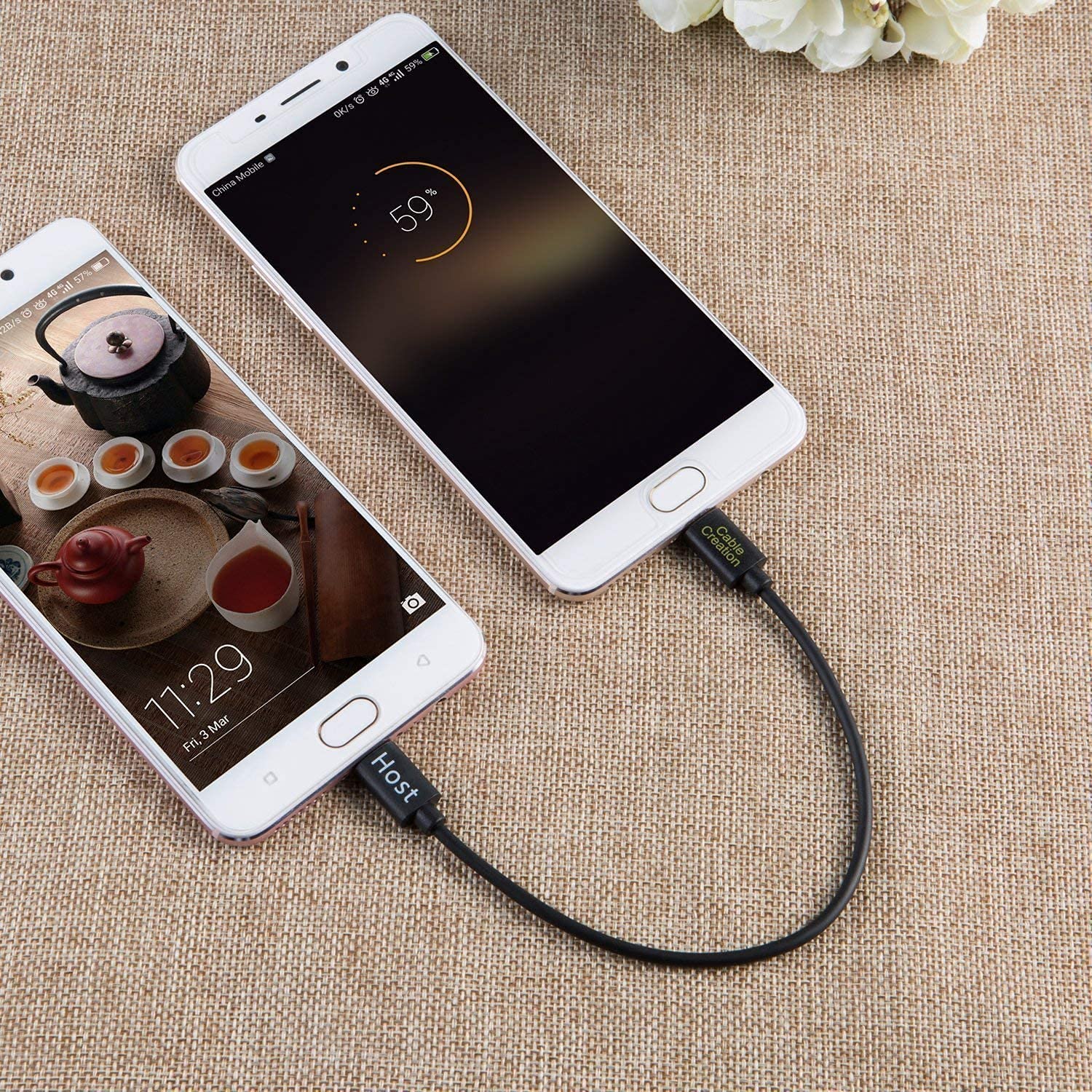 Micro USB OTG cable connecting two smartphones for emergency charging.