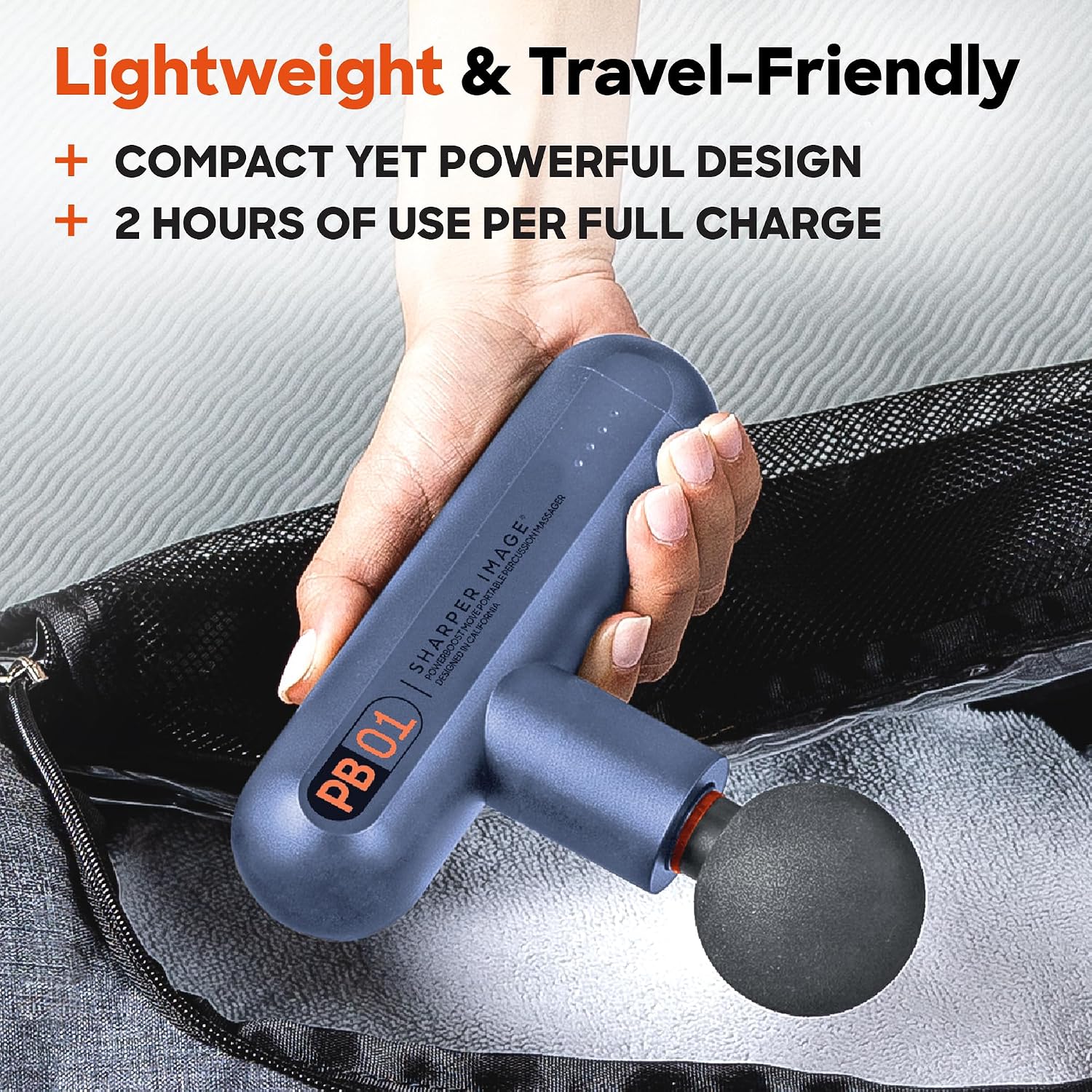 Hand placing Sharper Image Powerboost Move into a gym bag