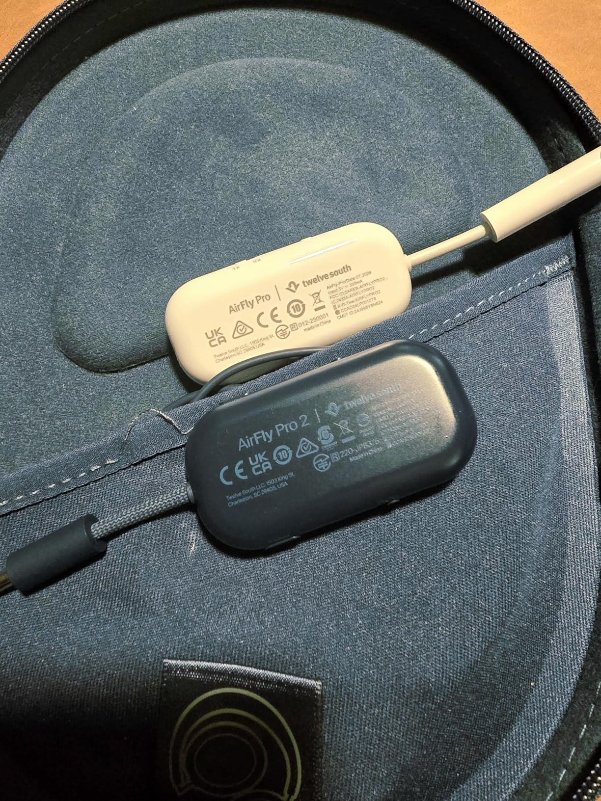 AirFly Pro 2 in both white and black color options