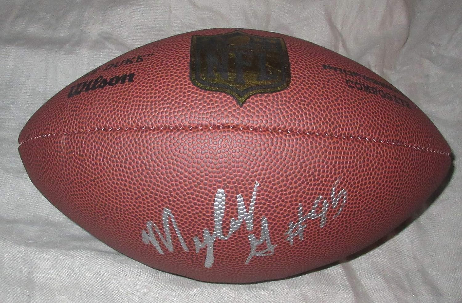 Myles Garrett Autographed Wilson NFL Shield Football W/PROOF, Picture of Myles Signing For Us, Cleveland Browns, Texas A&M Aggies, 2017 NFL Draft, Top Prospect