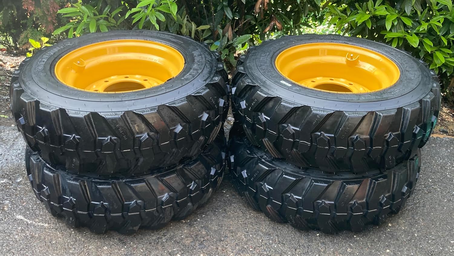 Set of 4-10-16.5 Forerunner SKS-1 Skid Steer Tires on Wheels/Rims (8 lug) for John Deere & more - 12PLY -10X16.5