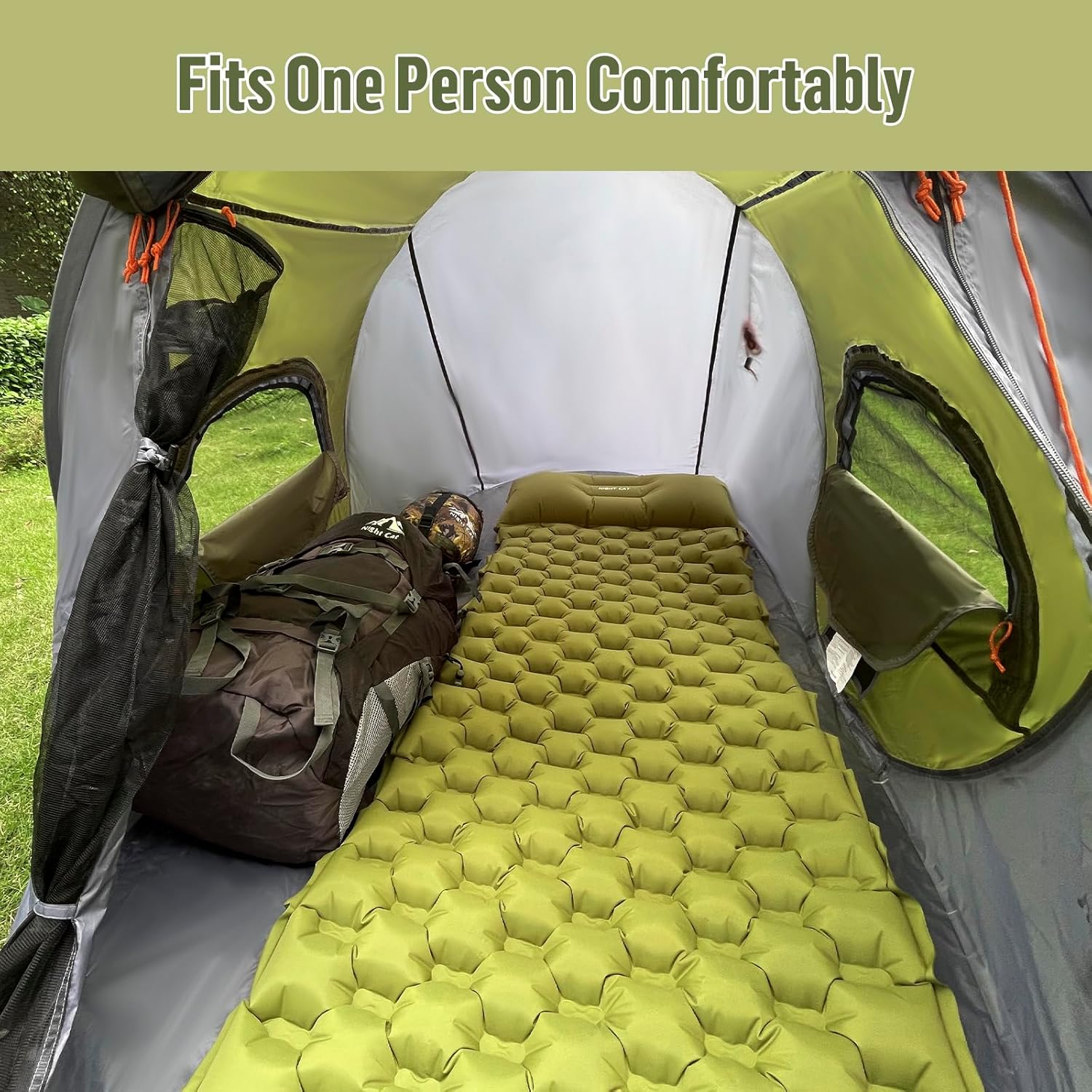 Interior view of the Night Cat Pop-up Camping Tent showing a sleeping pad and backpack, illustrating the roomy space for one person.
