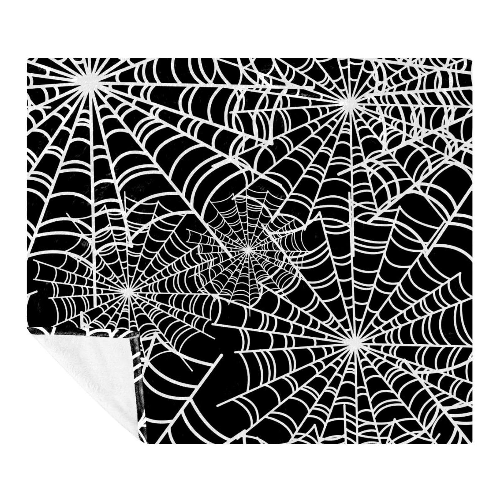 Couverture d'Halloween en polaire motif toile d'araignée pour se réchauffer sur le canapé