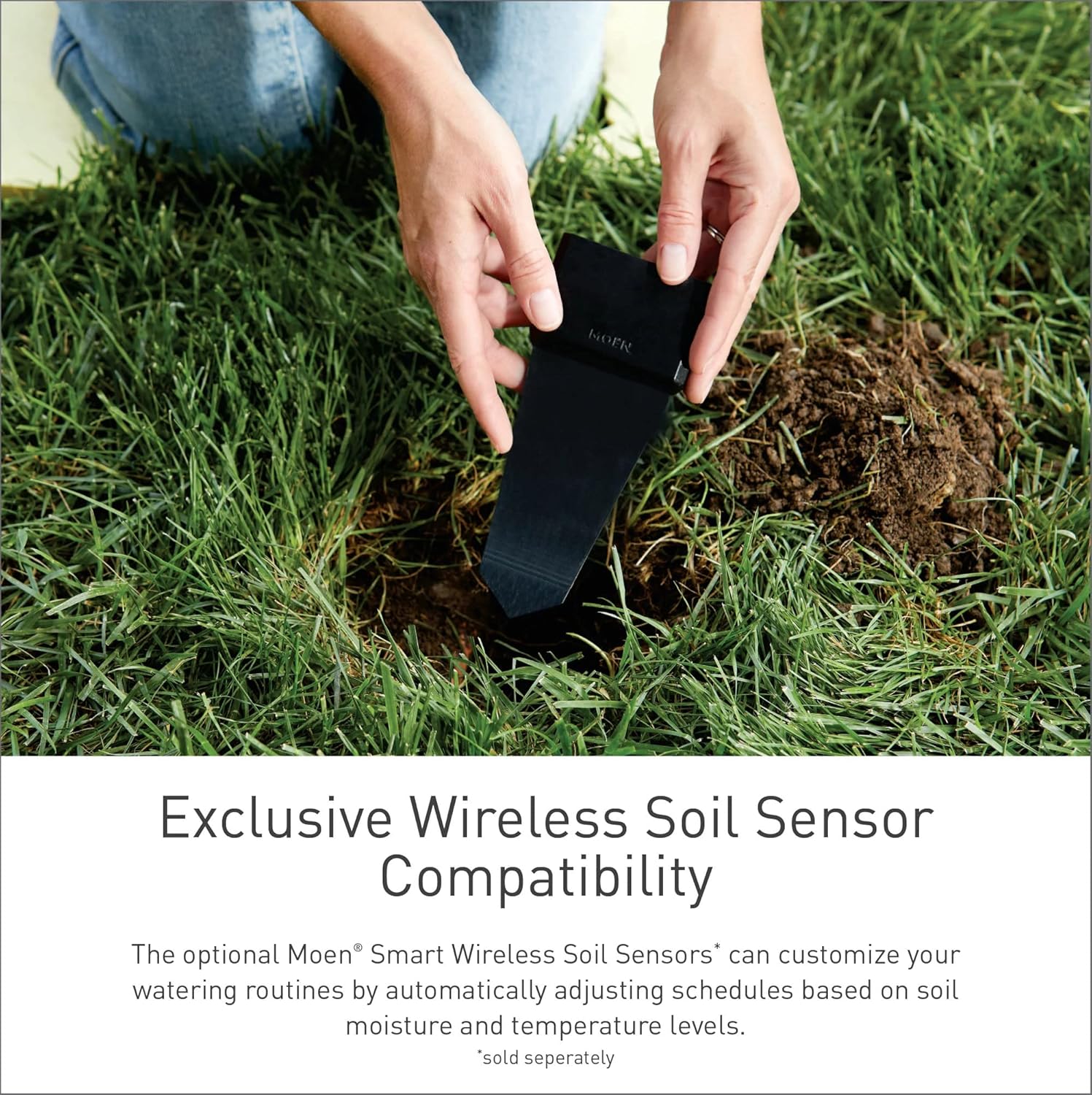 Hand installing a Moen Smart Wireless Soil Sensor into the ground