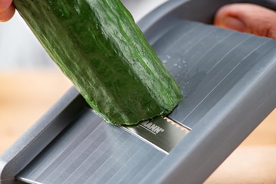Fackelmann Vegetable Slicer with Leftover Holder - Vegetable Cutter with Sharp Blade Made of Stainless Steel (Serrated Edge) - Space-Saving Slicer with Ergonomic Handle Ergonomic handle durable sharp blade dishwasher-safe made in Germany rust-proof