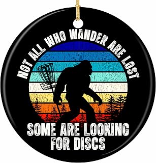 Disc Golf Christmas Ornament 2026 Funny Bigfoot Retro Gift | Bigfoot Silhouette Against a Retro Striped Sunset Beside a Chain Basket. Ceramic Keepsake for Disc Golfers.