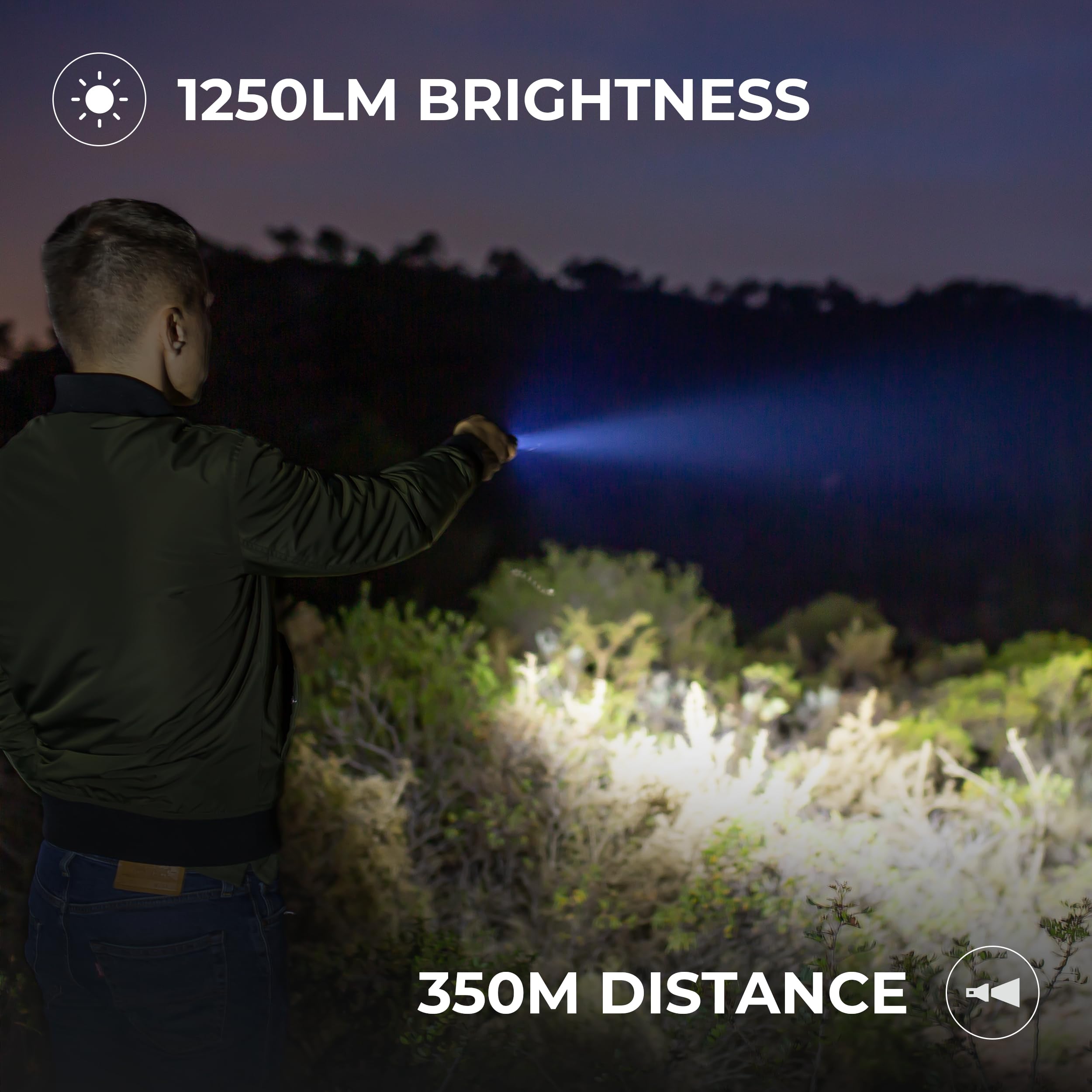 A person using the flashlight outdoors at night, illuminating a wide area with a bright beam.