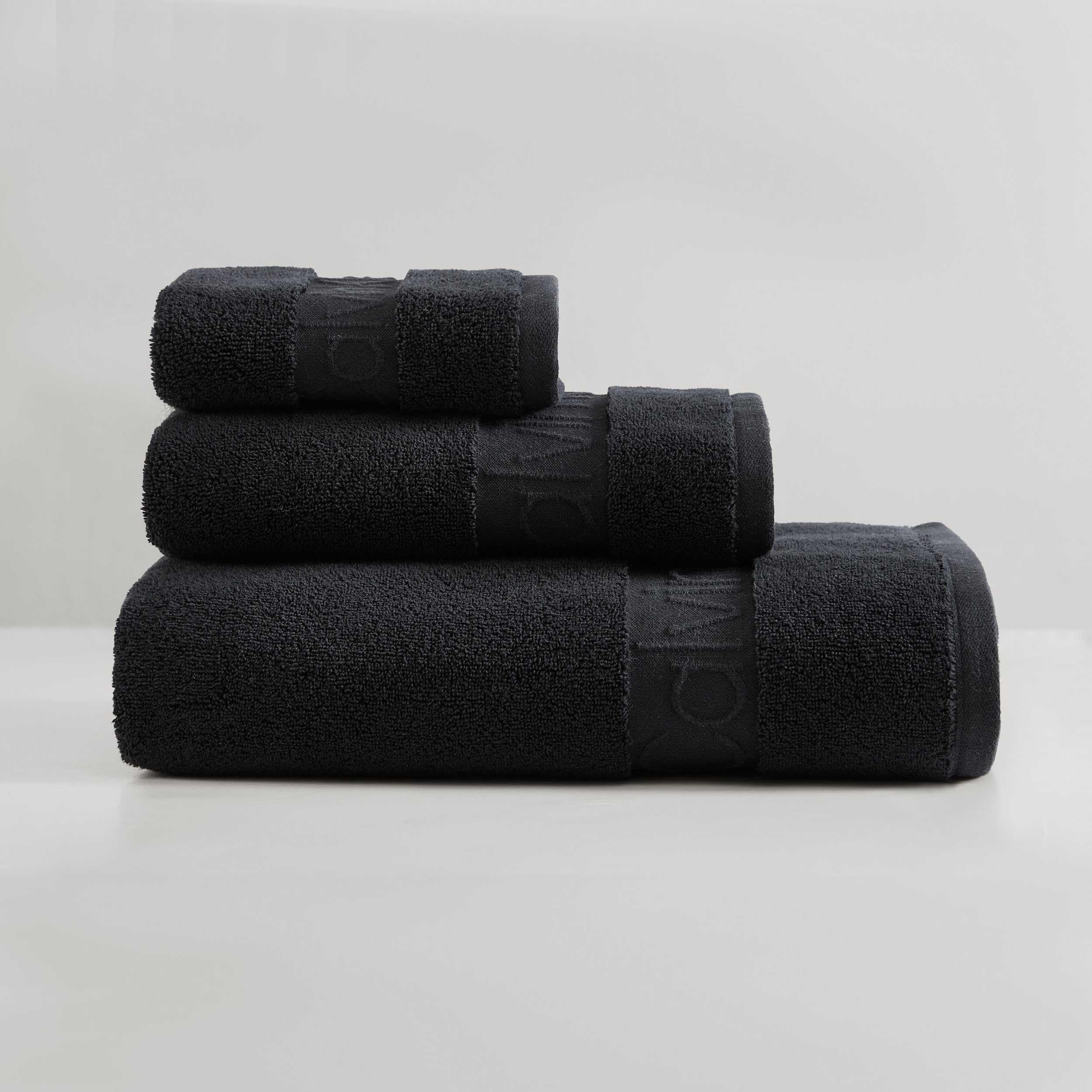 Calvin Klein - Bath Towels, Super Soft & Absorbent Cotton Towels, Zero Twist Construction, Brand Locker Loop for Easy Hanging (Iconic Solid Black, 3