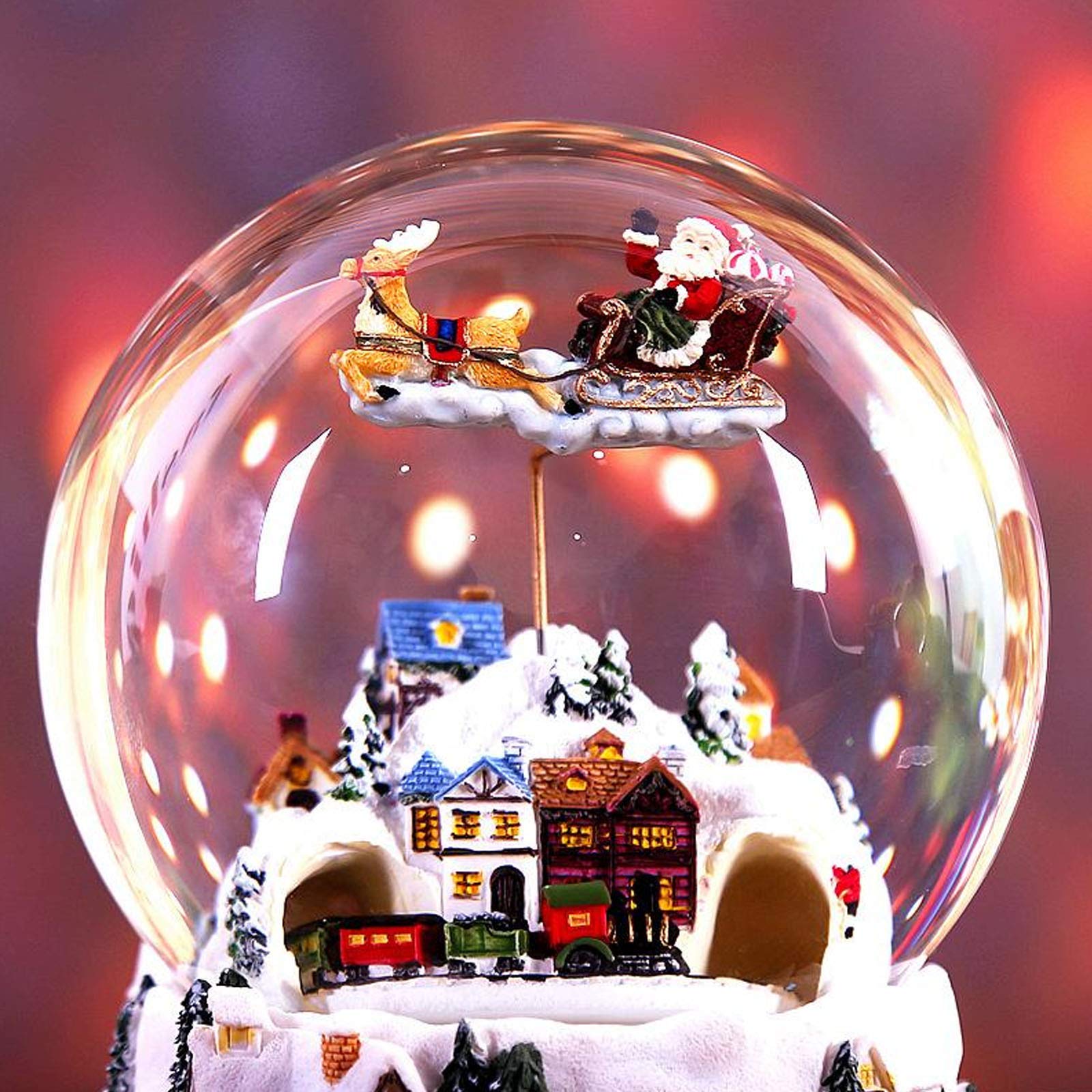Boule à neige musicale géante « Le village de Noël » avec un petit