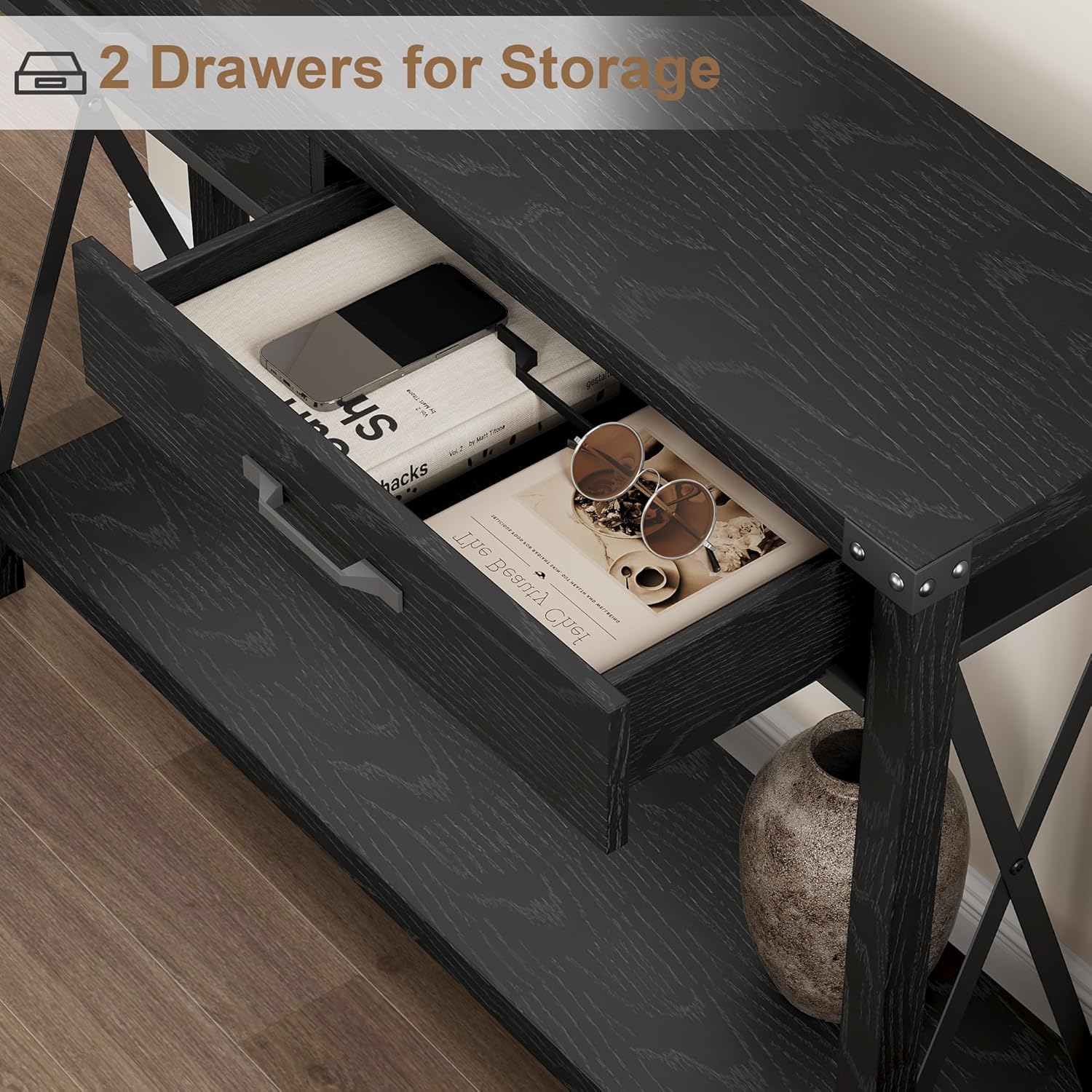 Close-up view of the two drawers on the console table, showing items stored inside