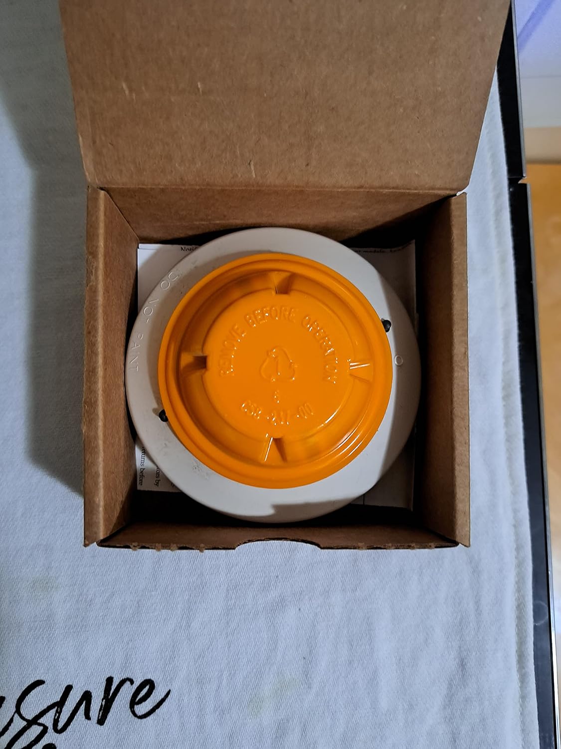 Notifier FAPT-851 Multi-Sensor with an orange protective cover