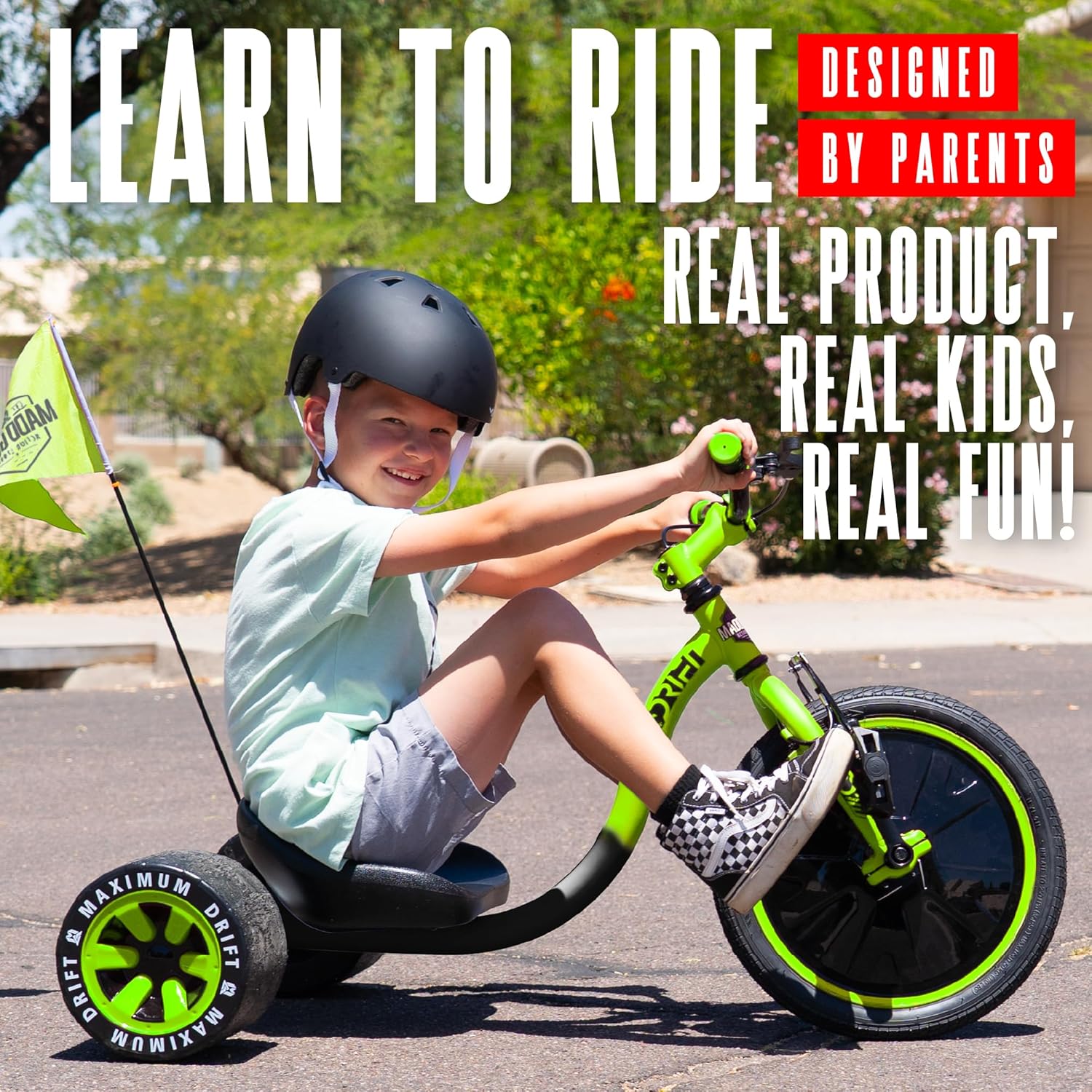 A child riding the Madd Gear Drift Trike outdoors, demonstrating its use.