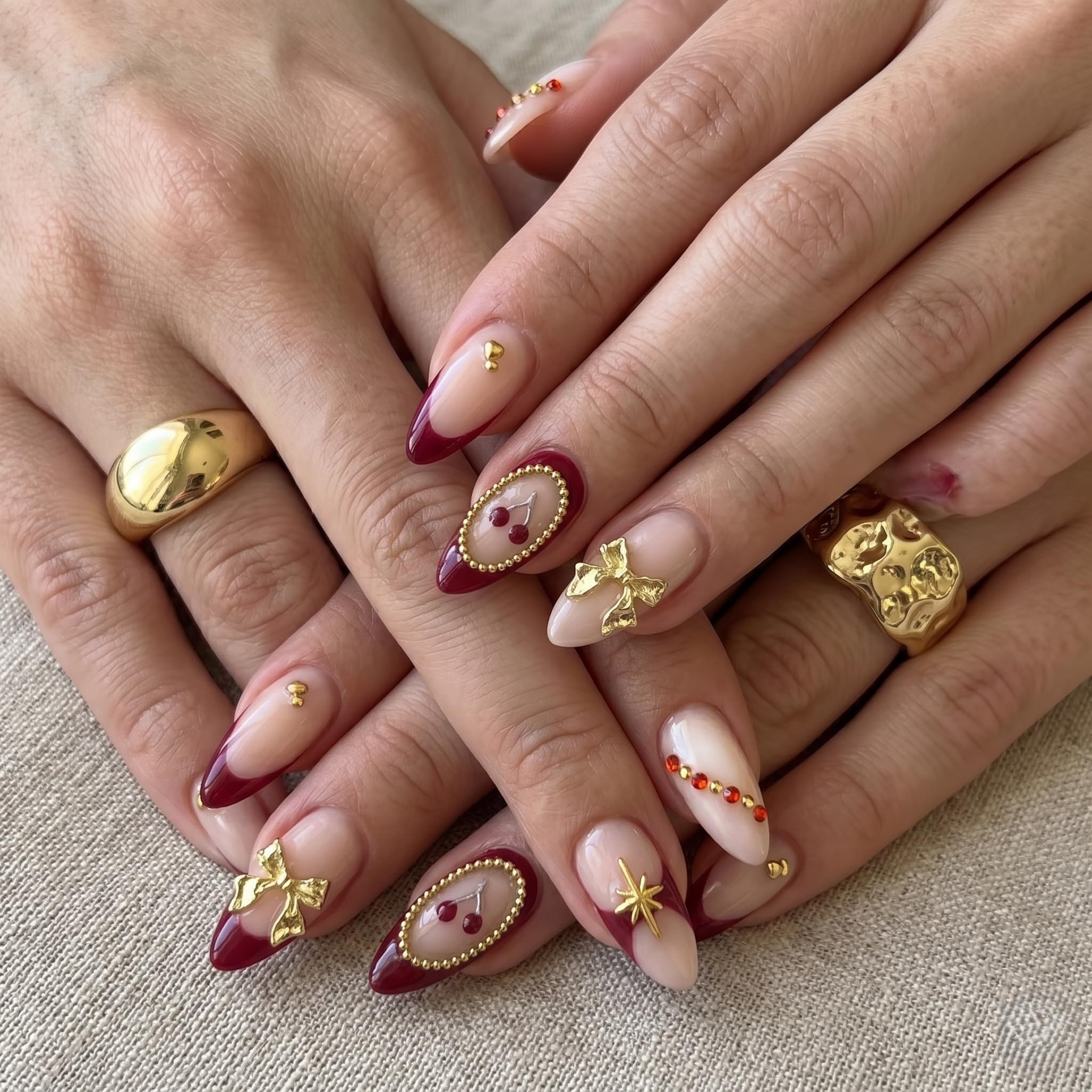 NAKHI Cherry French Tip Press On Nails for Women | Burgundy Red Almond Fake Nails with 3D Gold Bow, Rhinestones & Glossy Finish | Reusable Full Cover Stick On Nails Set 24 Pcs-image-35