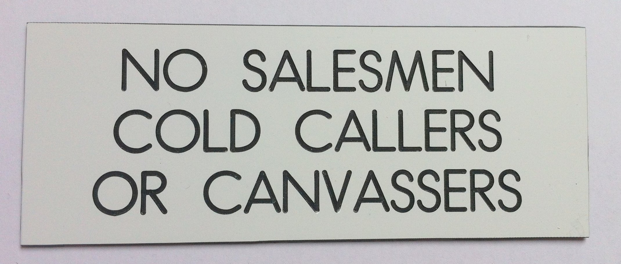 White Engraved Sign - No Salesmen Cold Callers Or Canvassers By Engraved Sign - No Salesmen Cold Callers Or Canvassers