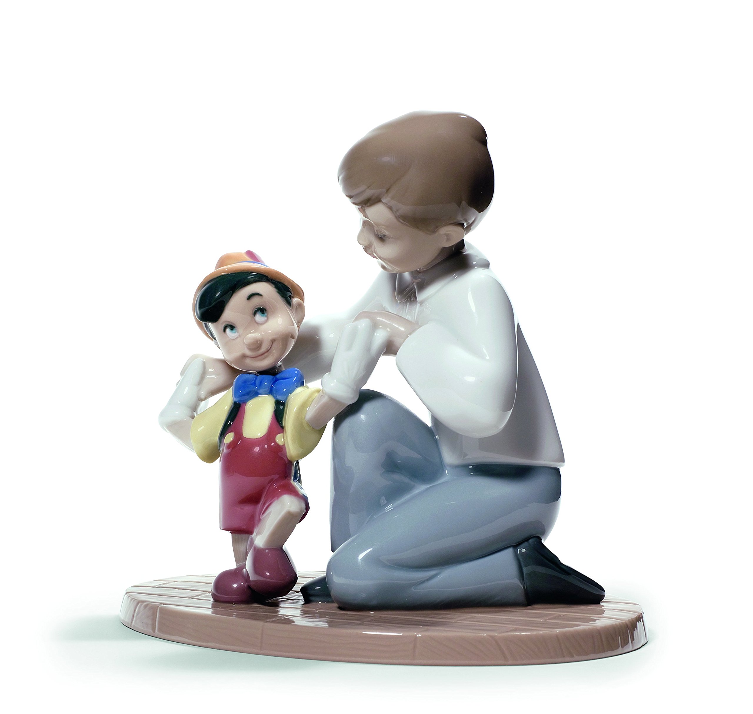 Nao Boys White Pinocchio's First Steps. Decorative Figurine Of A And Pinocchio In Gloss Porcelain. Ornamental Children’s Sculpture With The Famous Disney Character To Celebrate The Magic Of Childhood