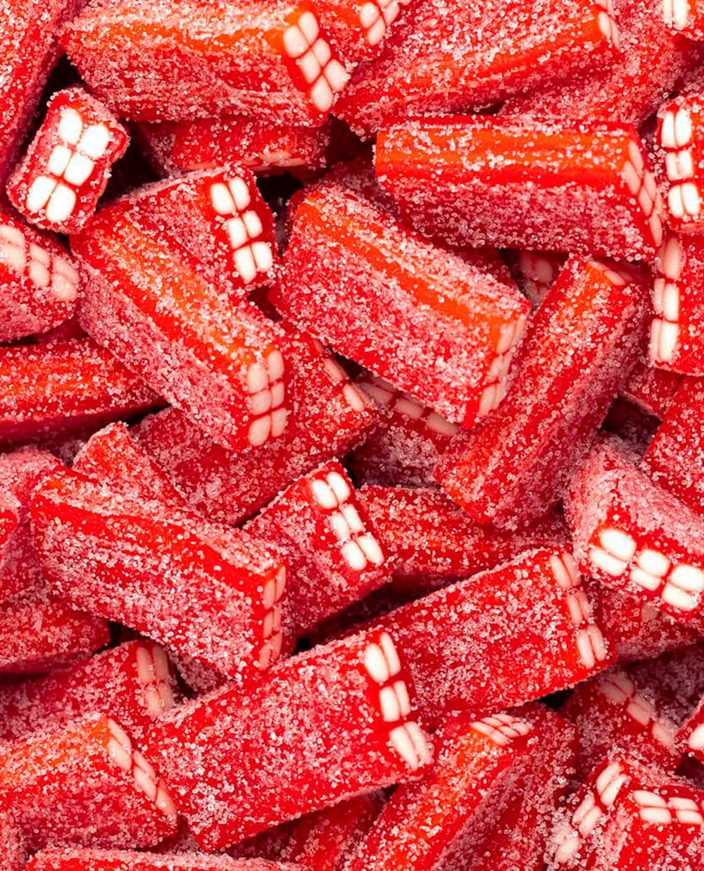 Vidal Golosinas. Ladrillos de regaliz rellenos Pica Fresa. Regaliz con forma de ladrillo sabor fresa y relleno de nata. Bolsa de 250 unidades